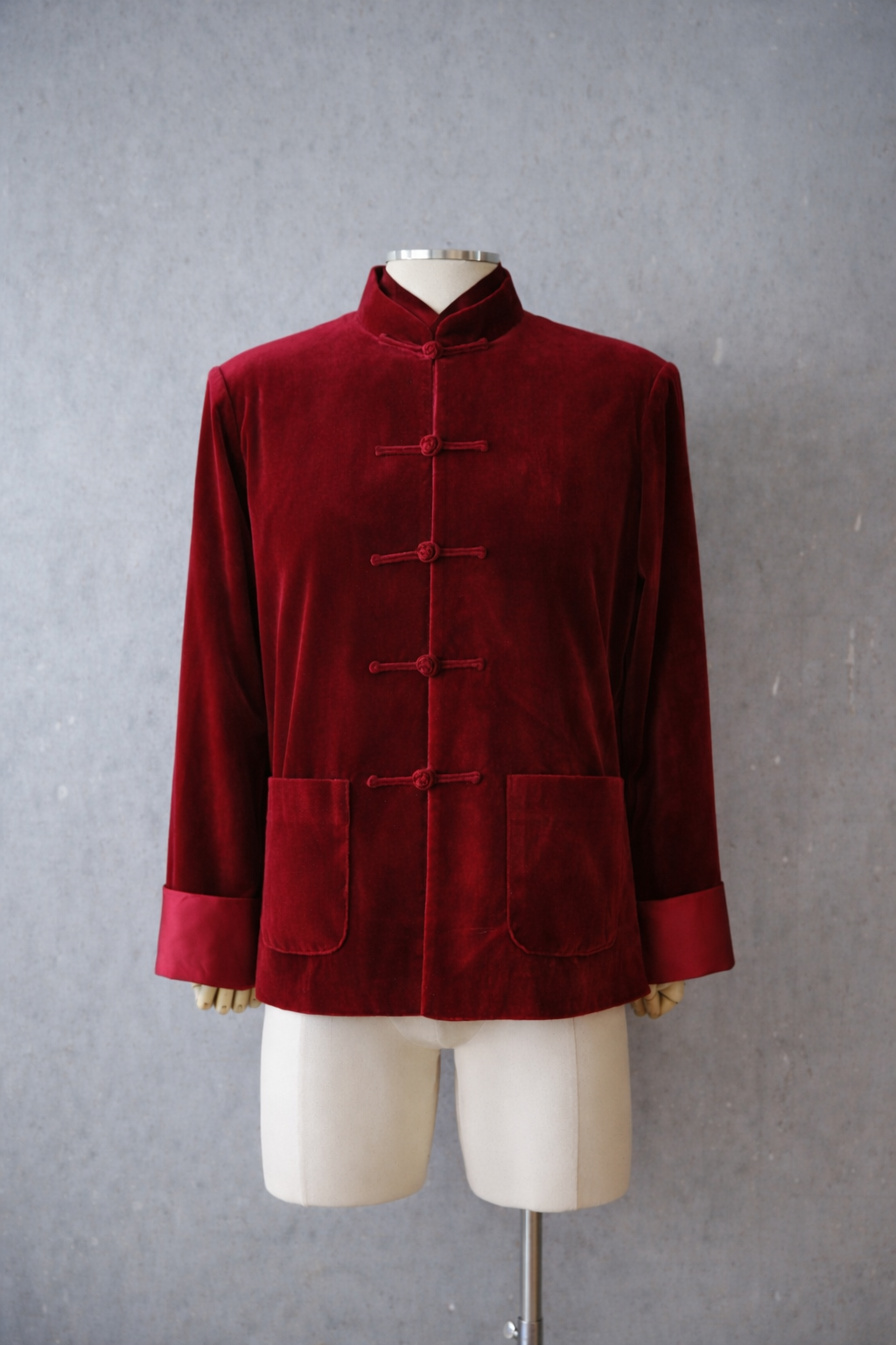 Red silk velvet Tang suit worn for Lunar New Year celebration
