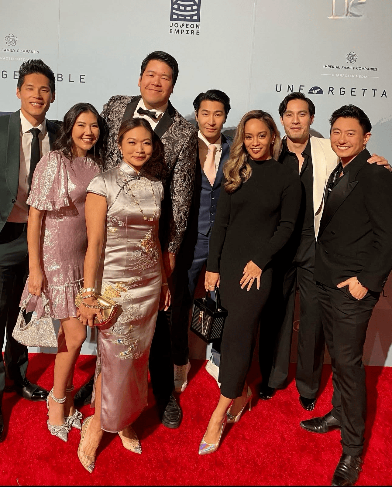 Director Adele Lim wearing a custom silver Qipao with landscape hand embroidery designed by JINZA Oriental Couture at the Unforgettable Gala in Los Angeles