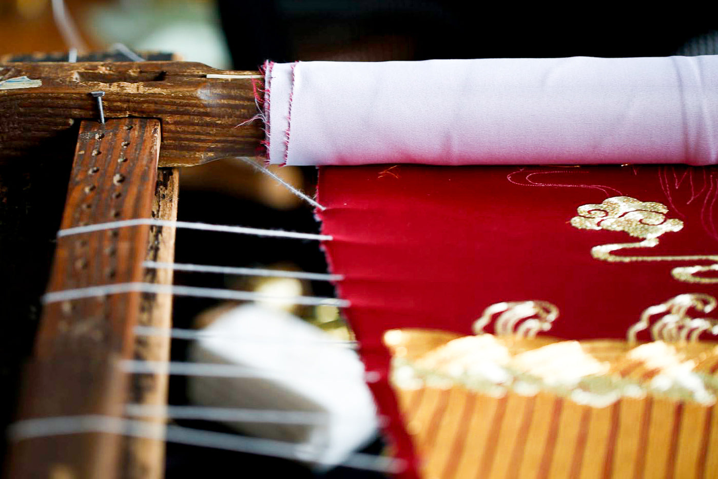 Close-up of Qipao embroidery in the JINZA couture atelier.