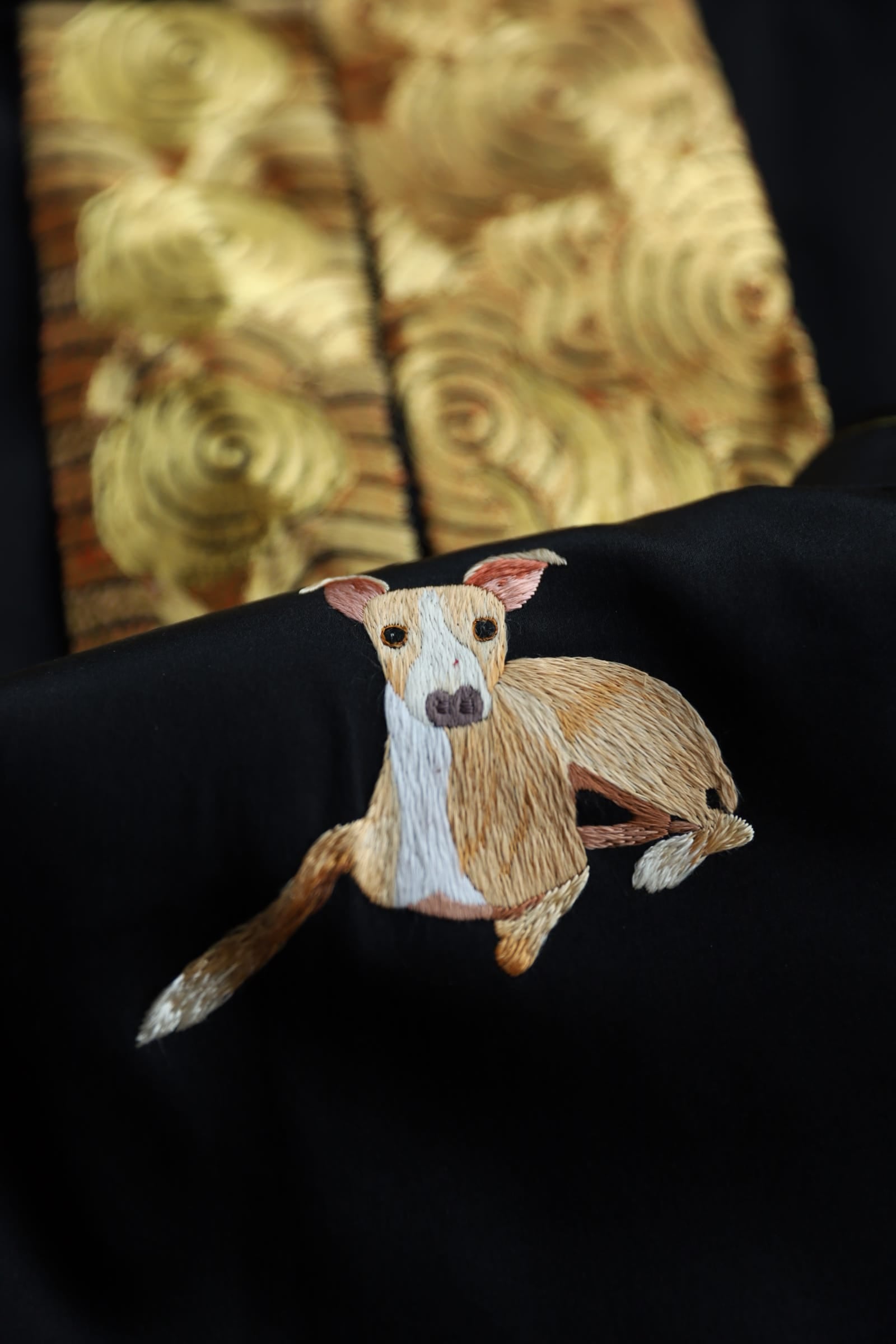 Bespoke black silk tang suit with custom hand embroidered family pet dog portrait worn by groom at wedding, JINZA Los Angeles