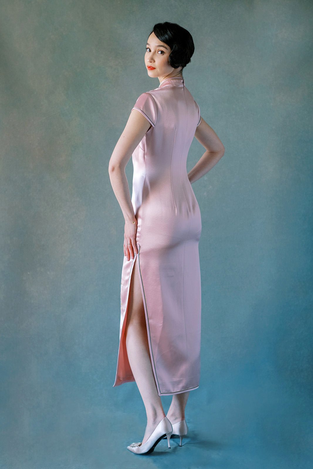 Back view of blush pink silk Cheongsam dress with butterfly garden embroidery.