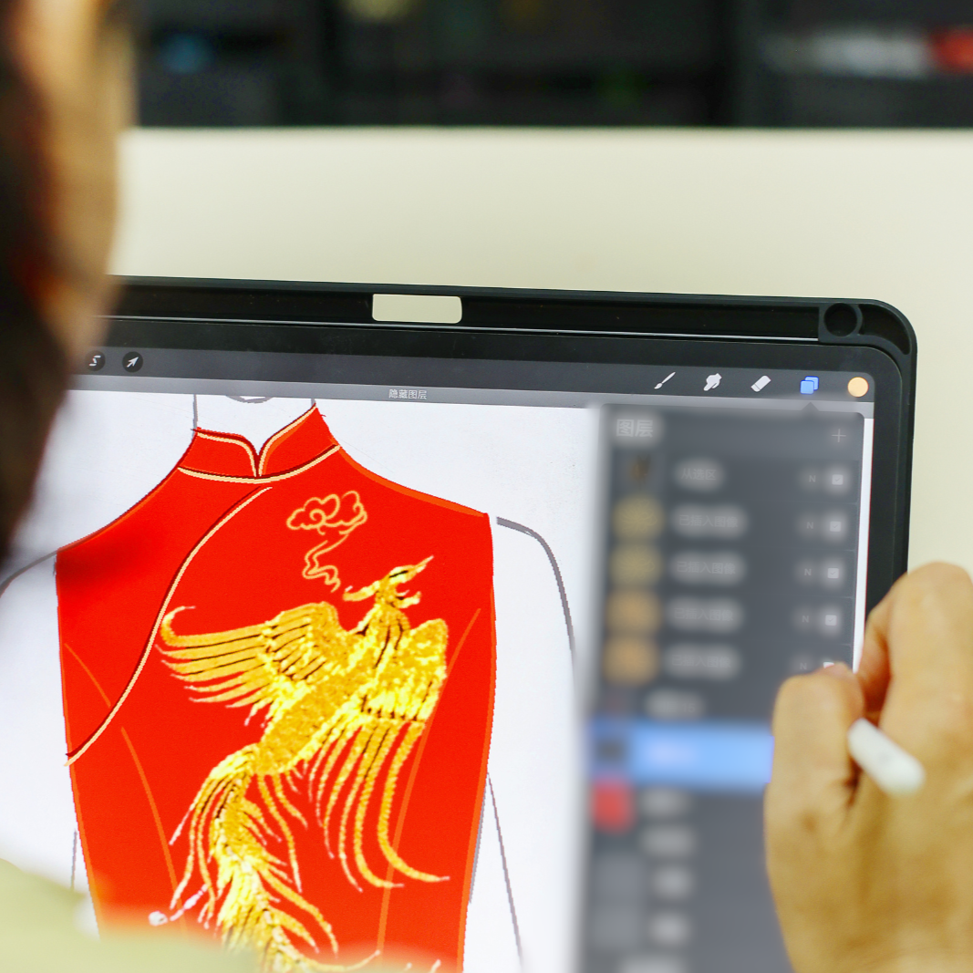 Step 1 Consultation – Designer sketching Qipao silhouette with client