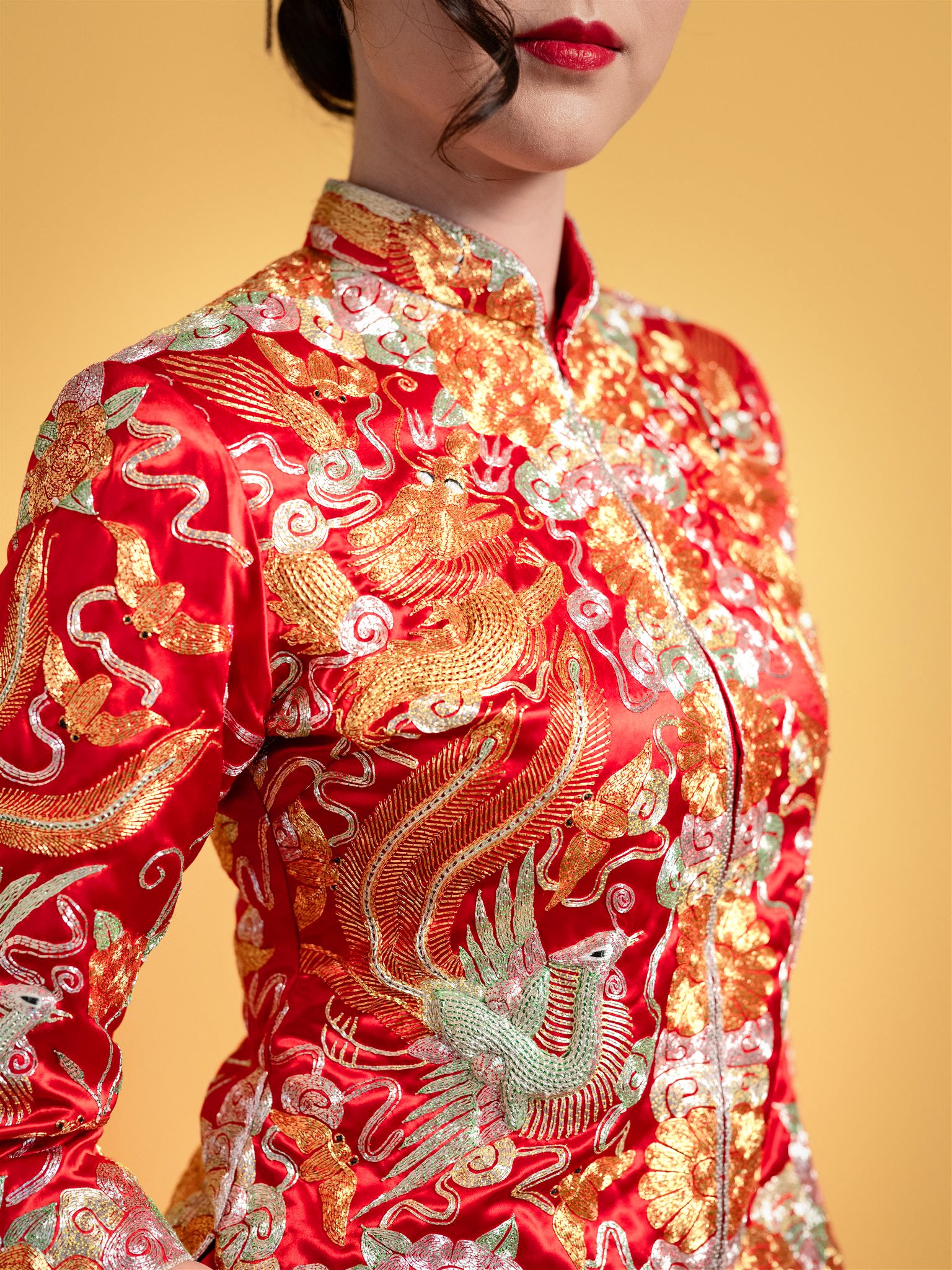 red Chinese wedding dress with hand-embroidered dragon and phoenix.