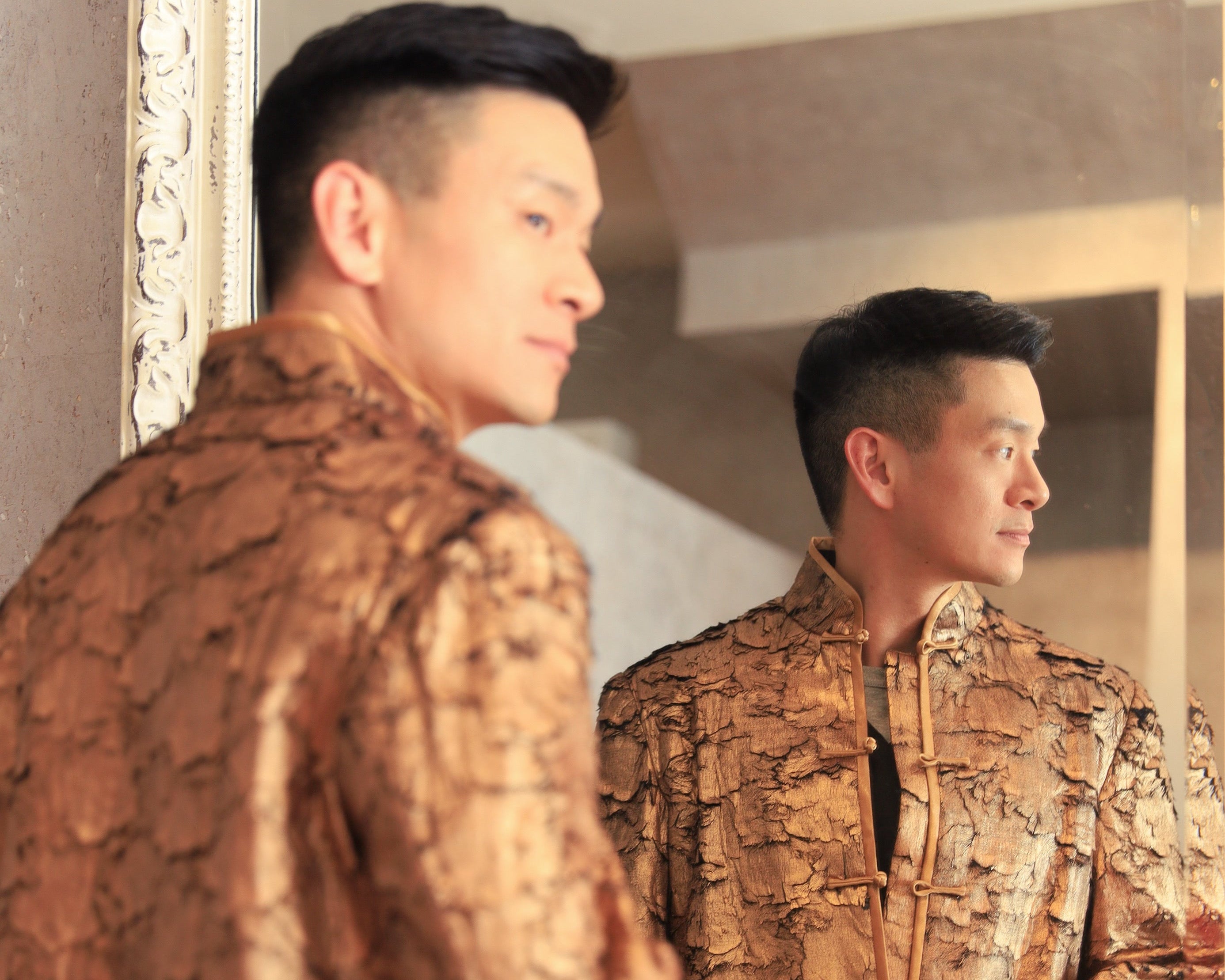 Evan Low, California State Assemblymember, wearing a gold leaf Tang suit jacket at Asia Society Southern California event