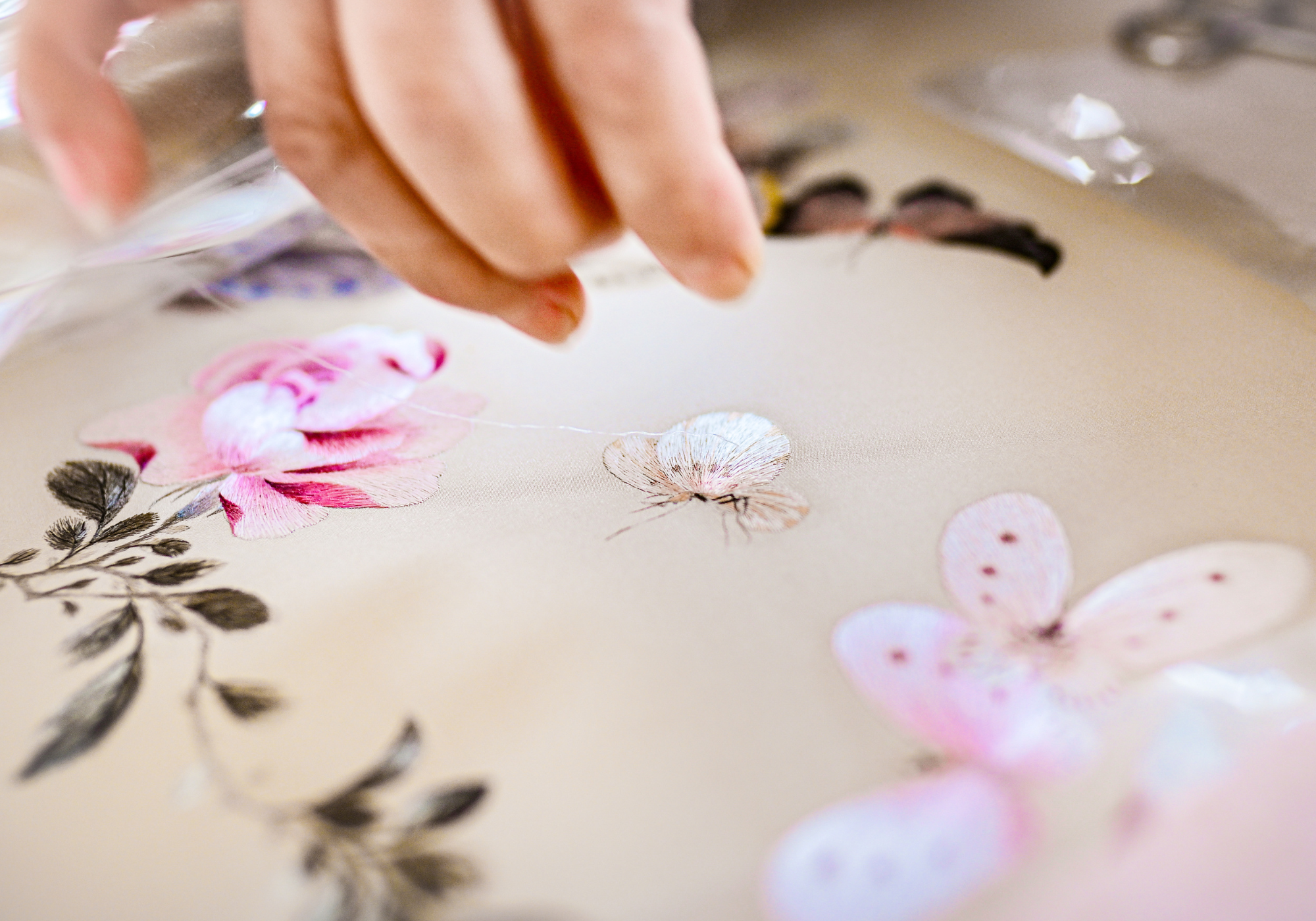 Giving back through handcrafted Qipao embroidery supporting community and cultural heritage