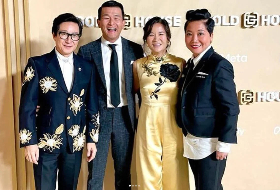 Ronny Chieng's wife: Hannah Chieng in JINZA custom-designed gold Qipao jumpsuit with black hand-embroidered rose.