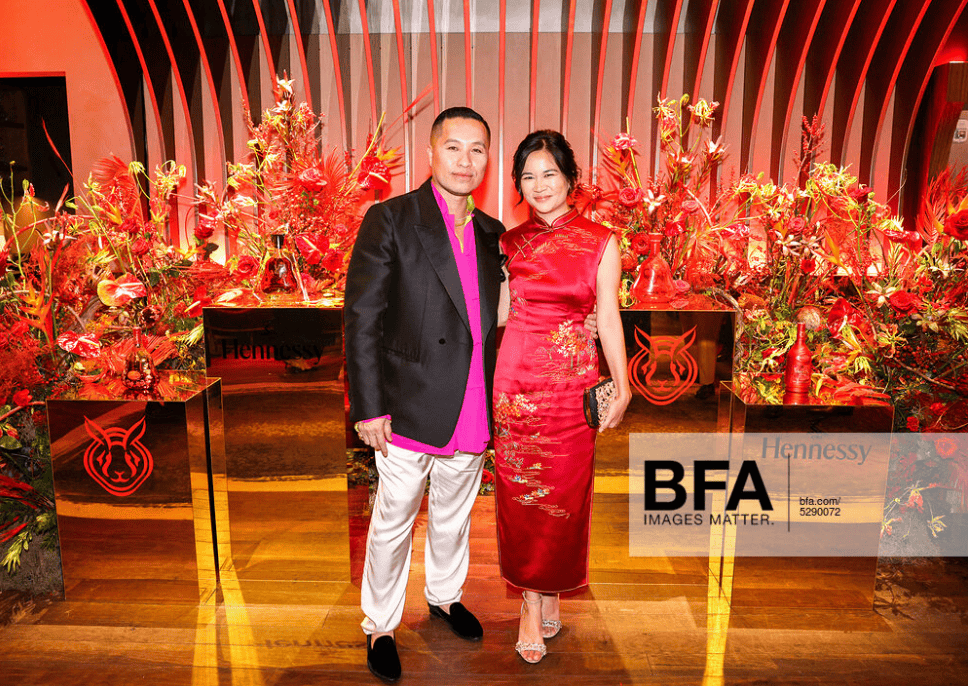 Hannah Pham wearing a custom red wedding Qipao with landscape embroidery, made with designer Phillip Lim