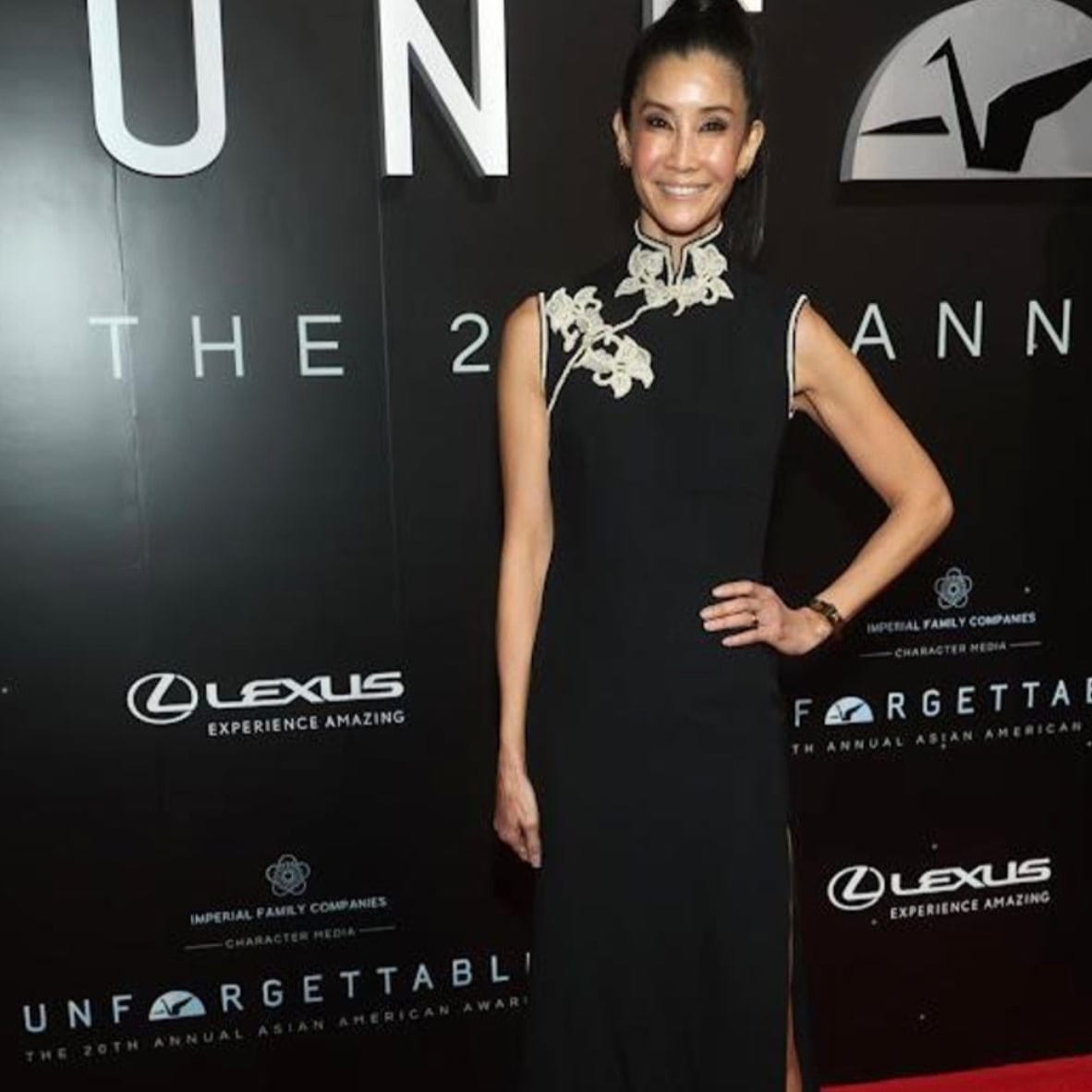 Lisa Ling wearing a custom black silk mermaid Qipao with Indian embroidery and mandarin collar