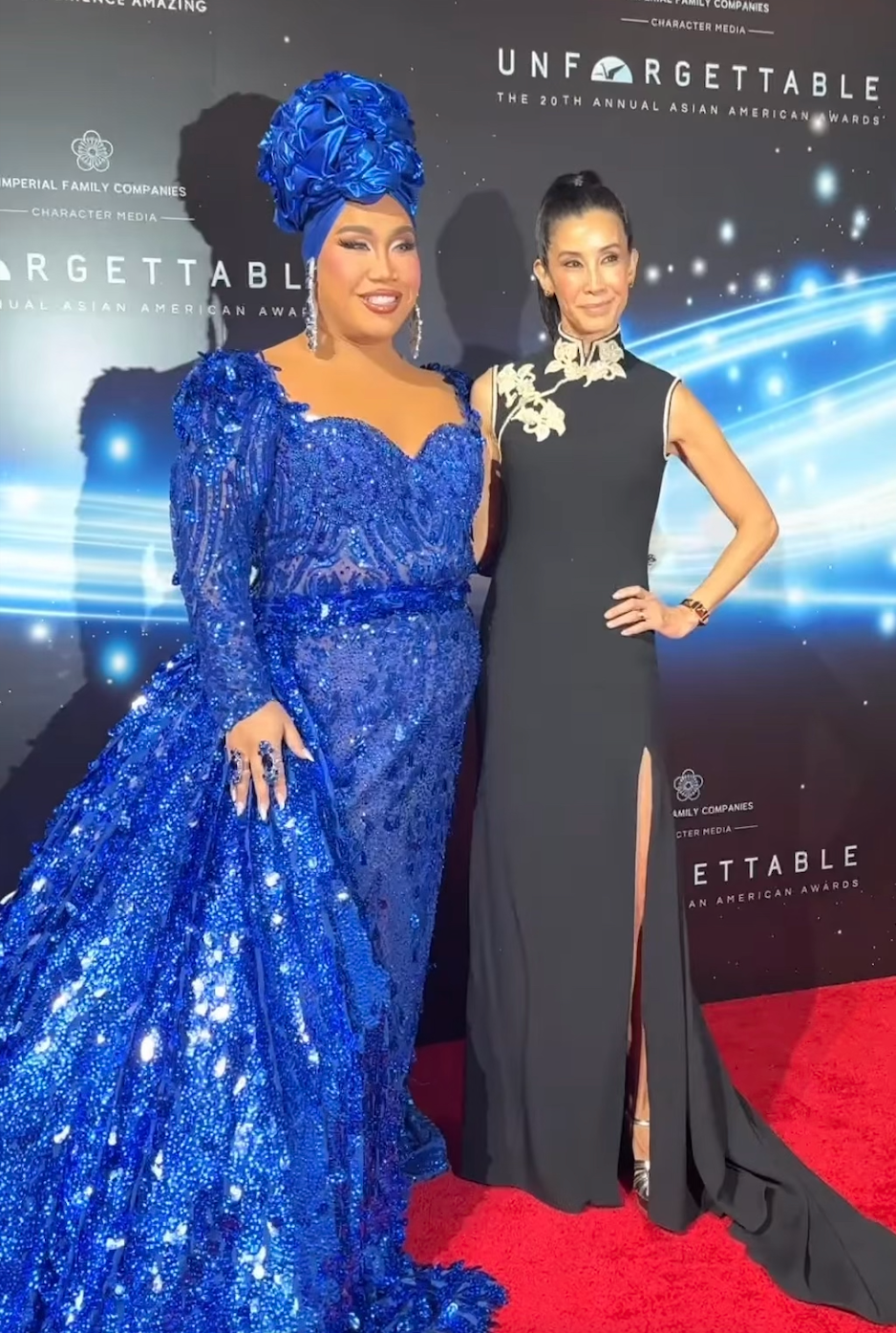 Journalist Lisa Ling wearing a black silk crepe modern Cheongsam with Indian embroidery by JINZA Oriental Couture, photographed with Patrick Starrr at the Unforgettable Gala.