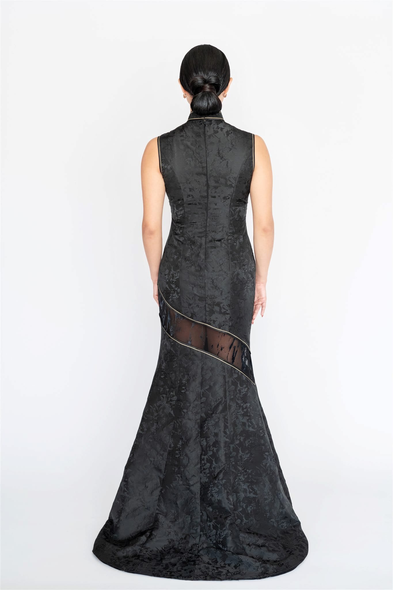 Back view of mermaid Cheongsam with lace cutout and chapel-length train.