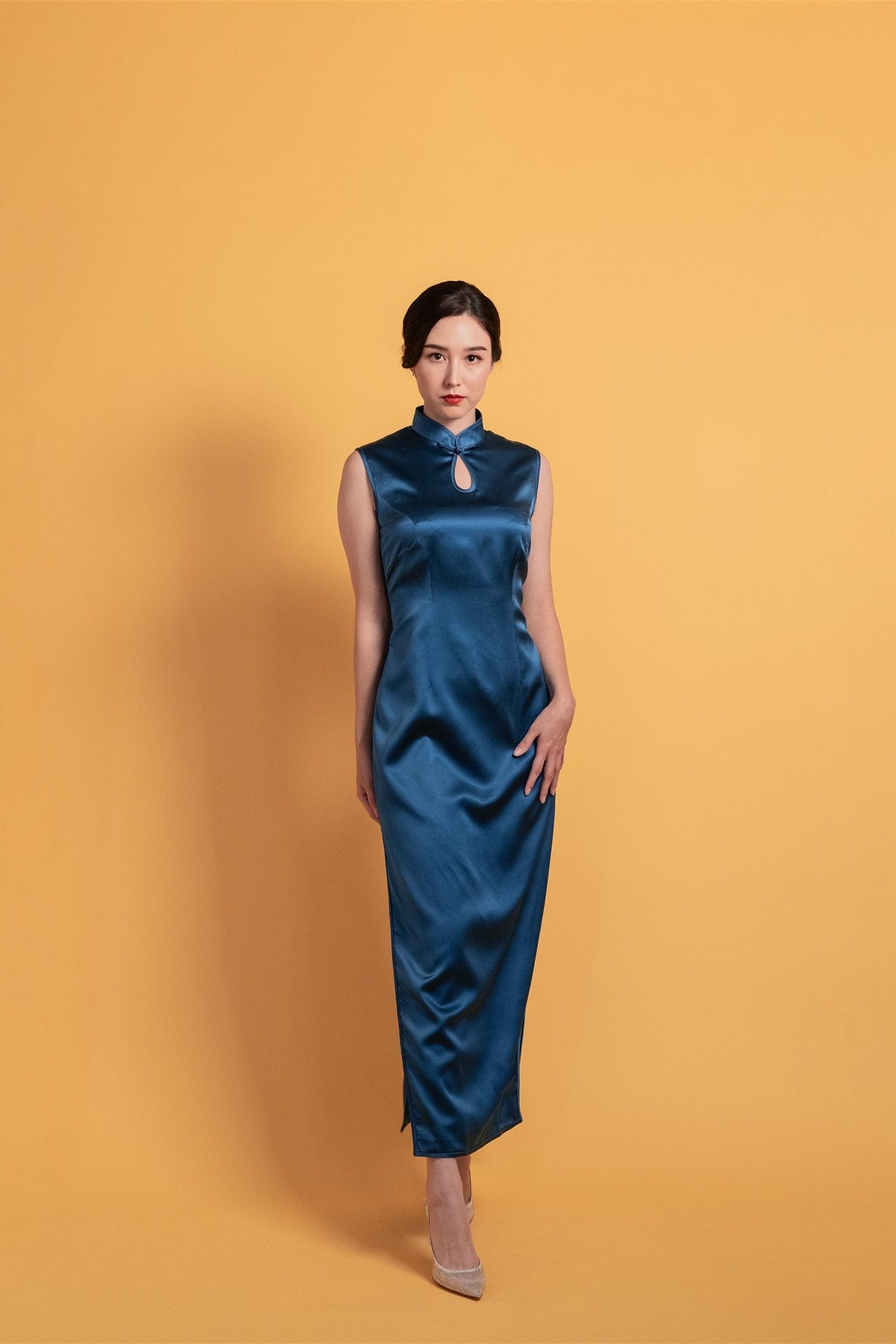 Navy blue silk Cheongsam with A-line silhouette and waterdrop neckline, front view.