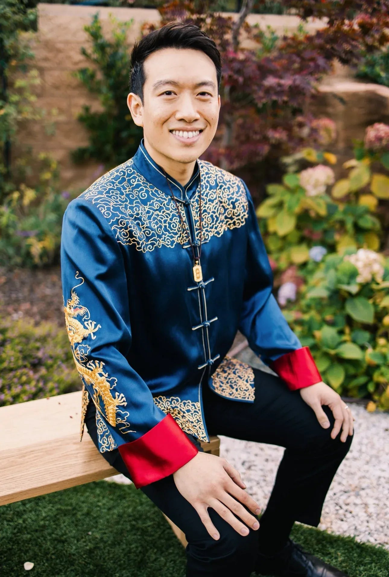Teal blue silk tang suit with dragon and lucky cloud embroidery worn by Kevin at his wedding, custom made to measure at JINZA Los Angeles.
