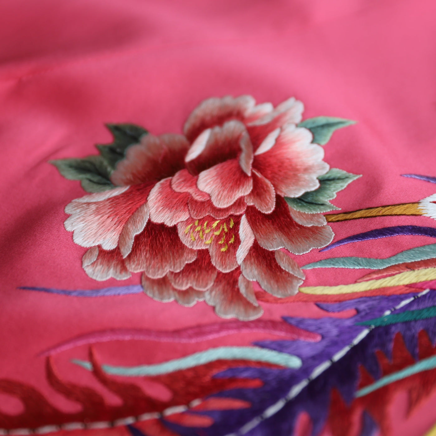 Silk peony embroidery symbolizing beauty and wealth on modern Cheongsam dress