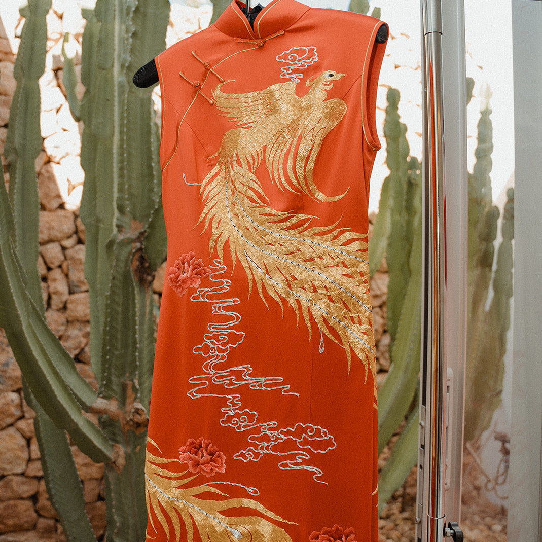 Hand-embroidered phoenix on red Qipao and dragon on black Tang suit worn by Shirley and Ted at their multicultural Ibiza wedding