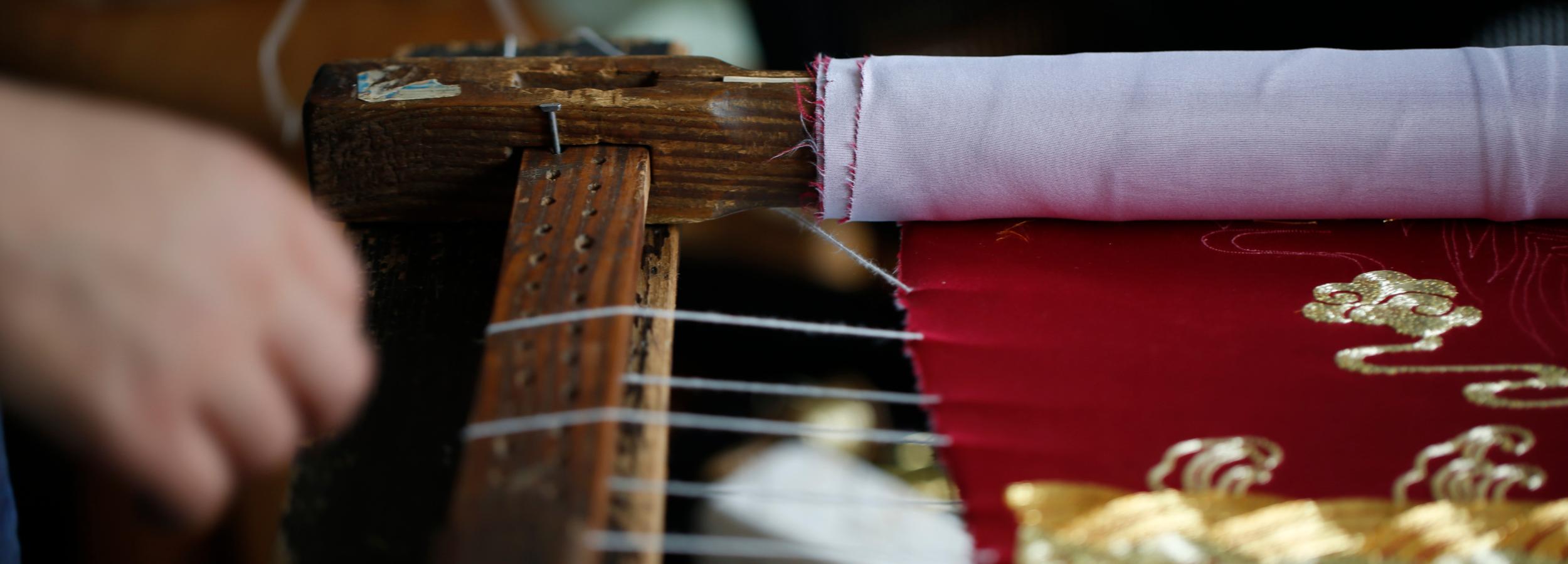 Hand drawing a custom Qipao embroidery design at JINZA