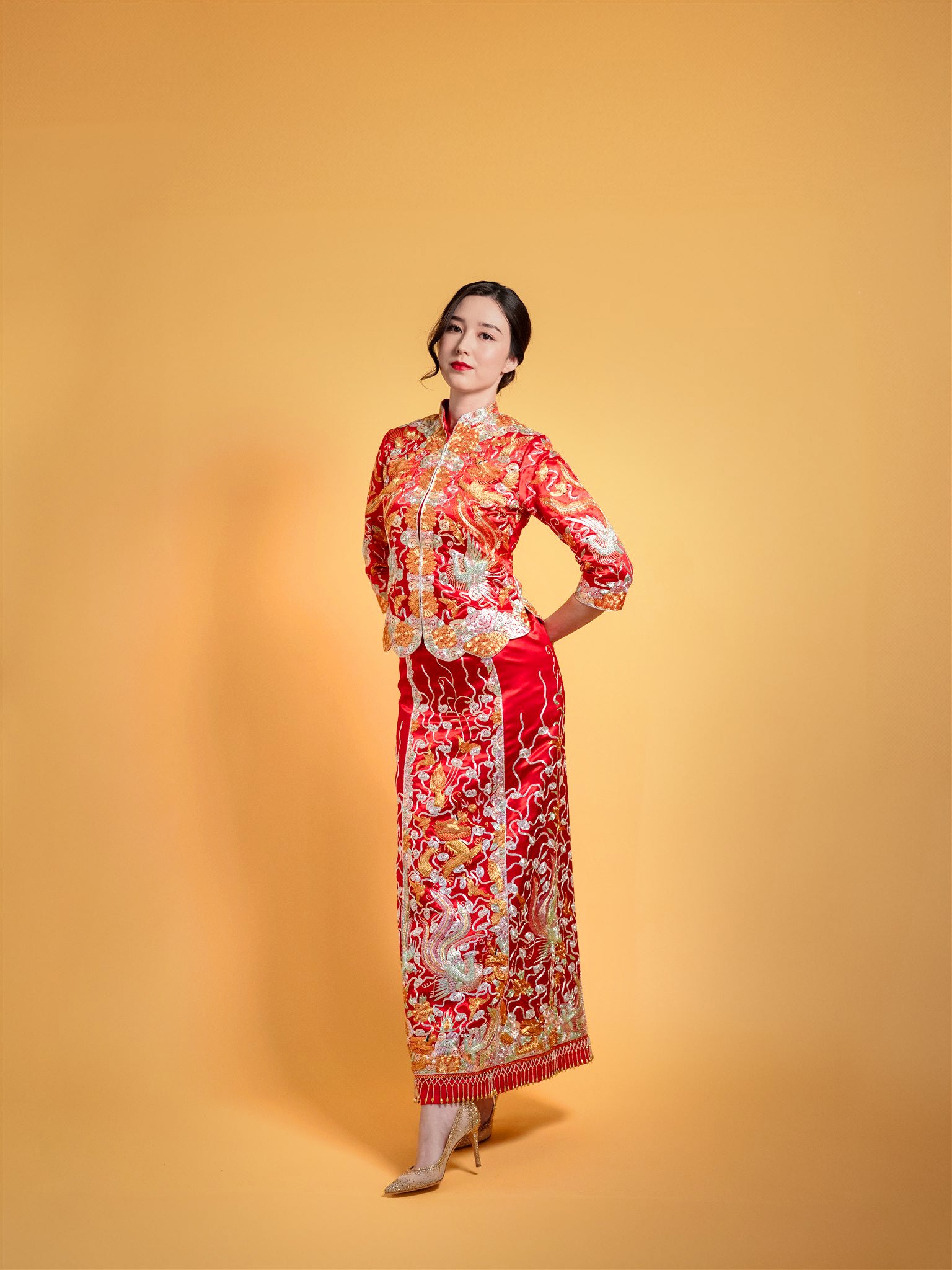 red Chinese wedding dress with gold embroidered dragon and phoenix, front view