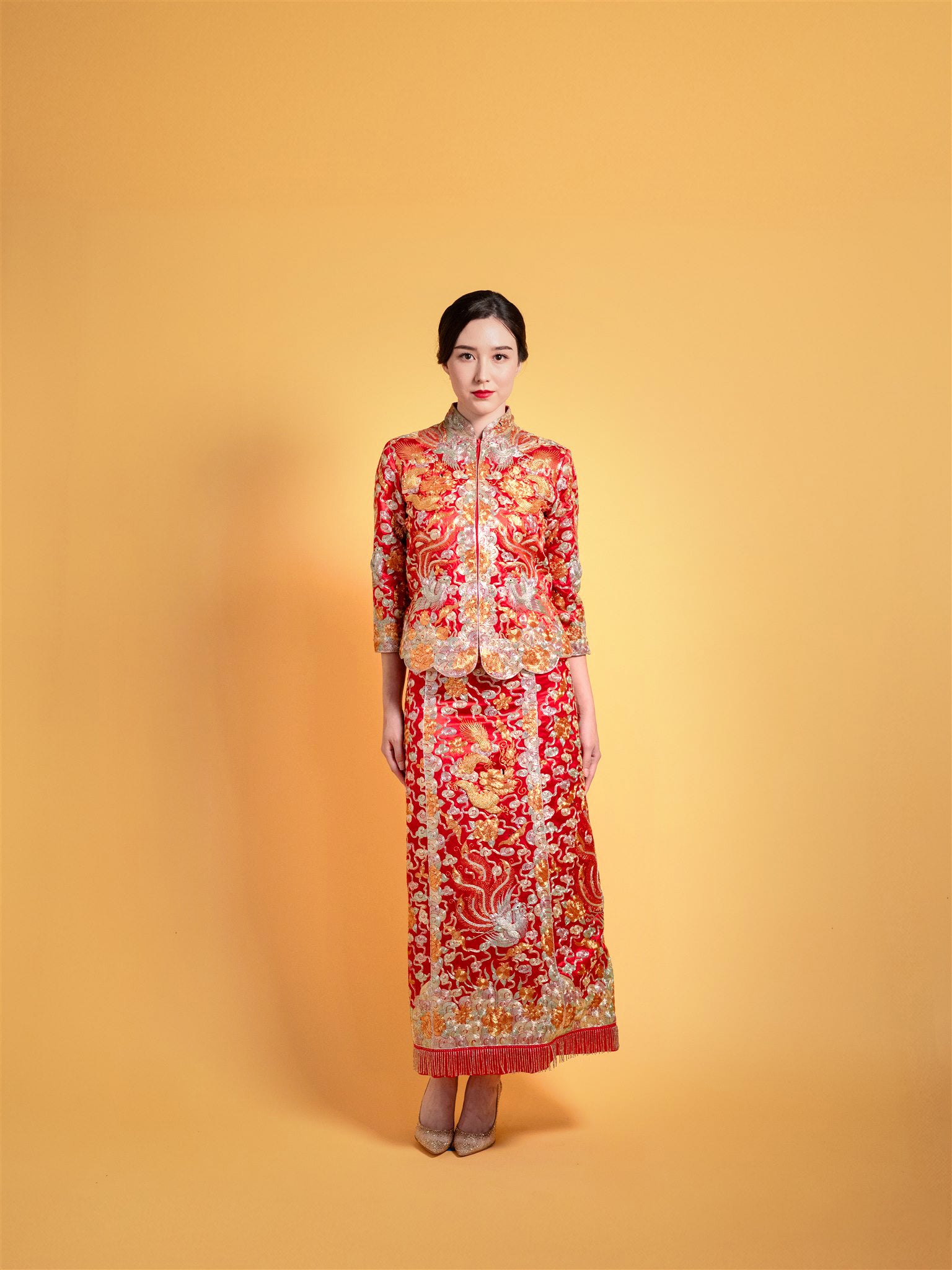 Bride in red Da Wu Fu Chinese wedding dress with gold dragon embroidery – front view