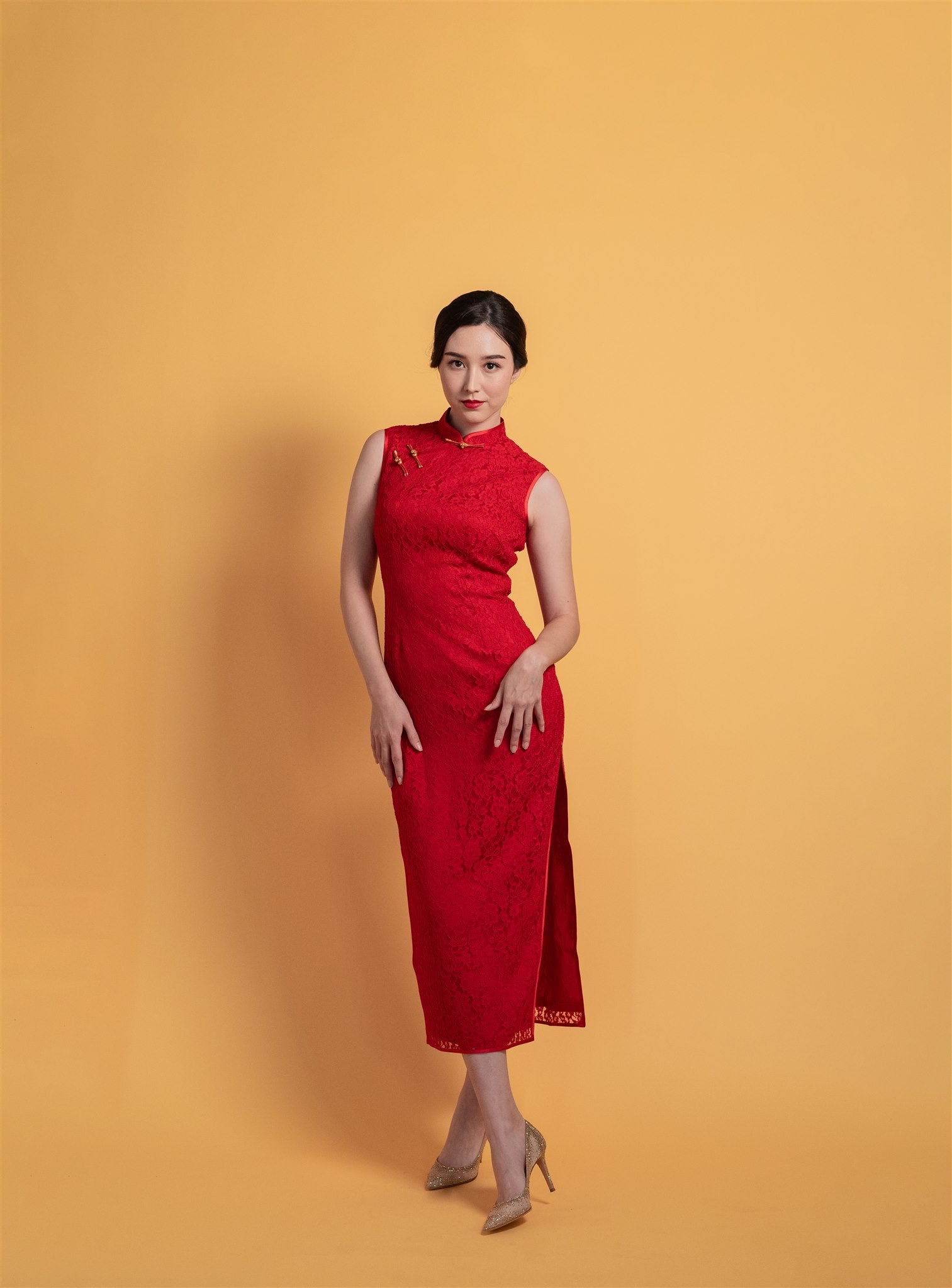 Front view of red lace sleeveless Qipao Chinese wedding dress with silk lining.