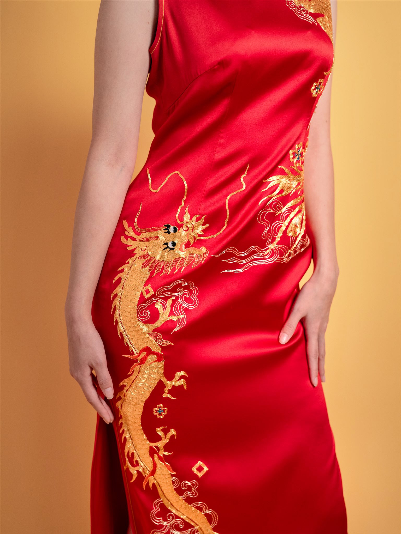 Embroidery detail of flying dragon on Red Silk Goldwork II Chinese wedding dress.