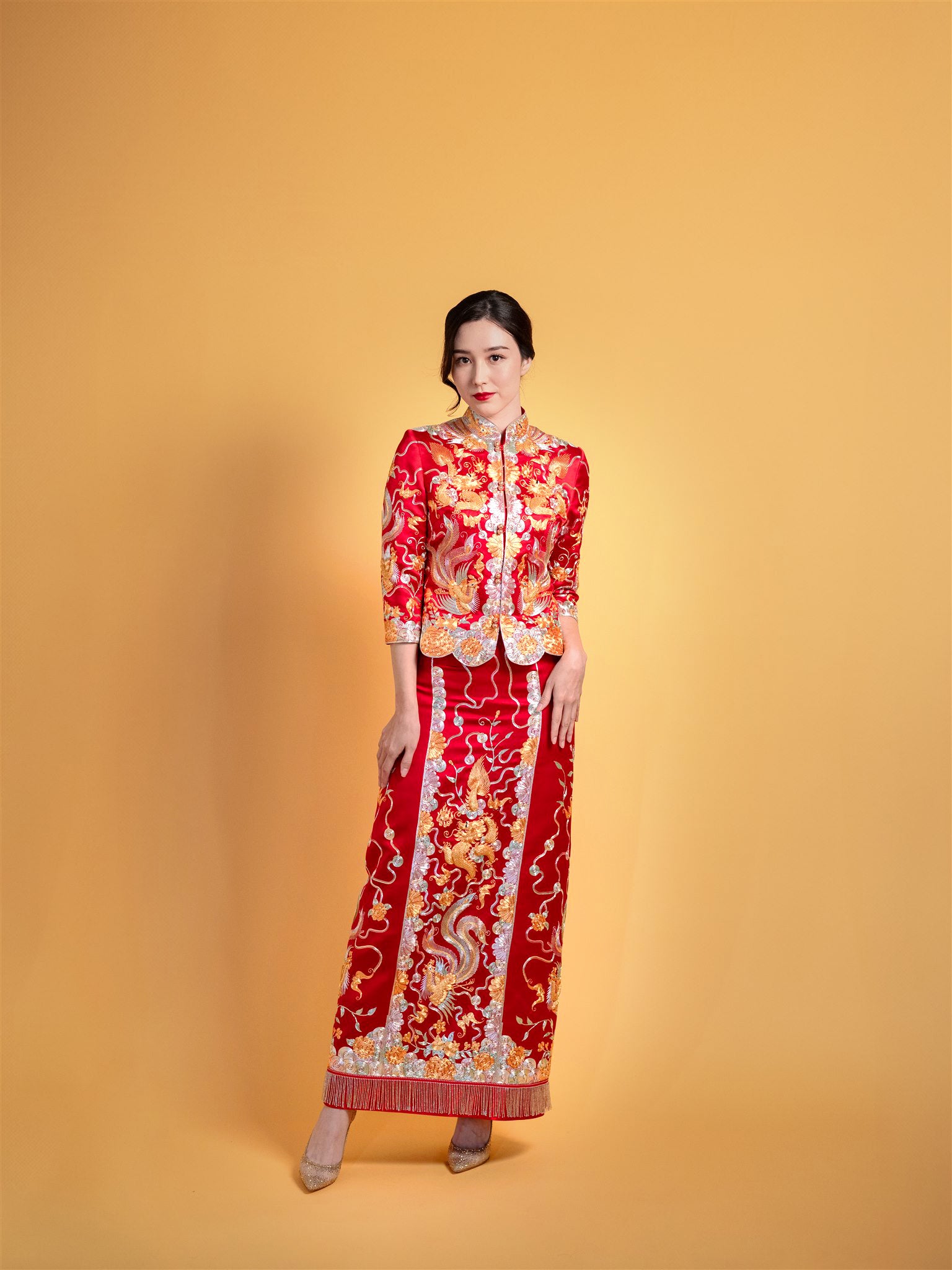 Bride wearing red Xiao Wu Fu Chinese wedding dress with phoenix – front view