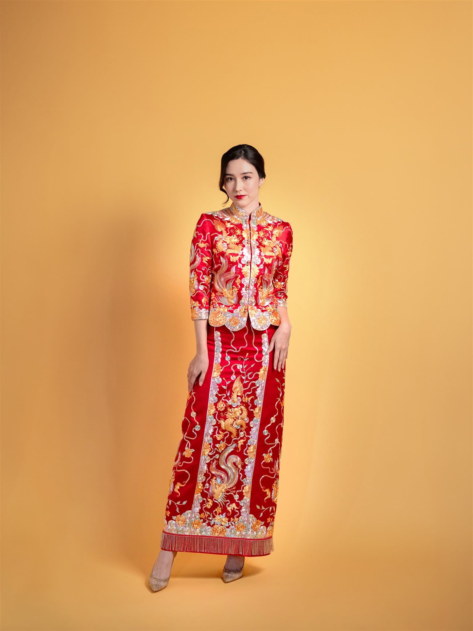 Bride wearing red Xiao Wu Fu Chinese wedding dress with phoenix – front view