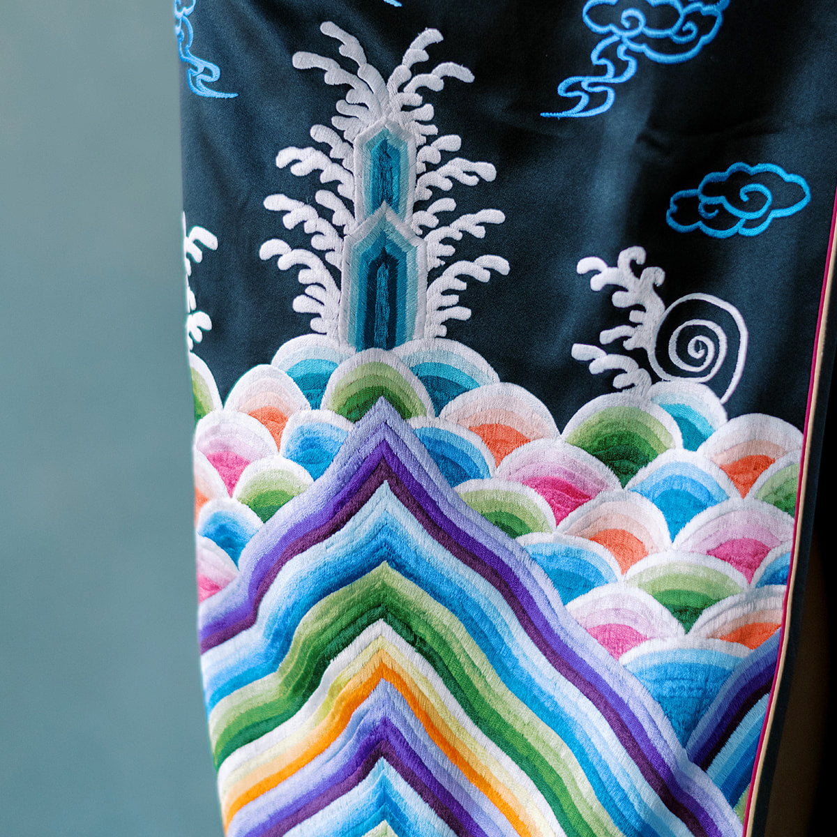 Sea wave embroidery on traditional Chinese Qipao symbolizing stability and noble spirit