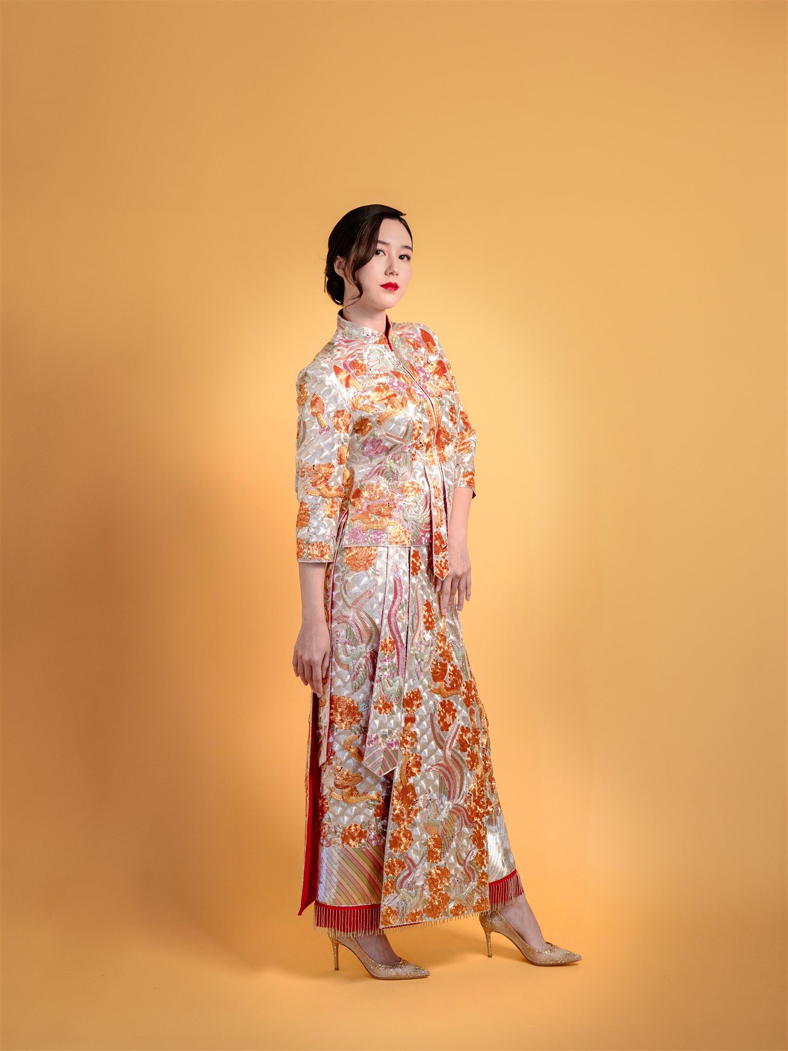 side view of silver qun kwa Chinese wedding dress with phoenix embroidery