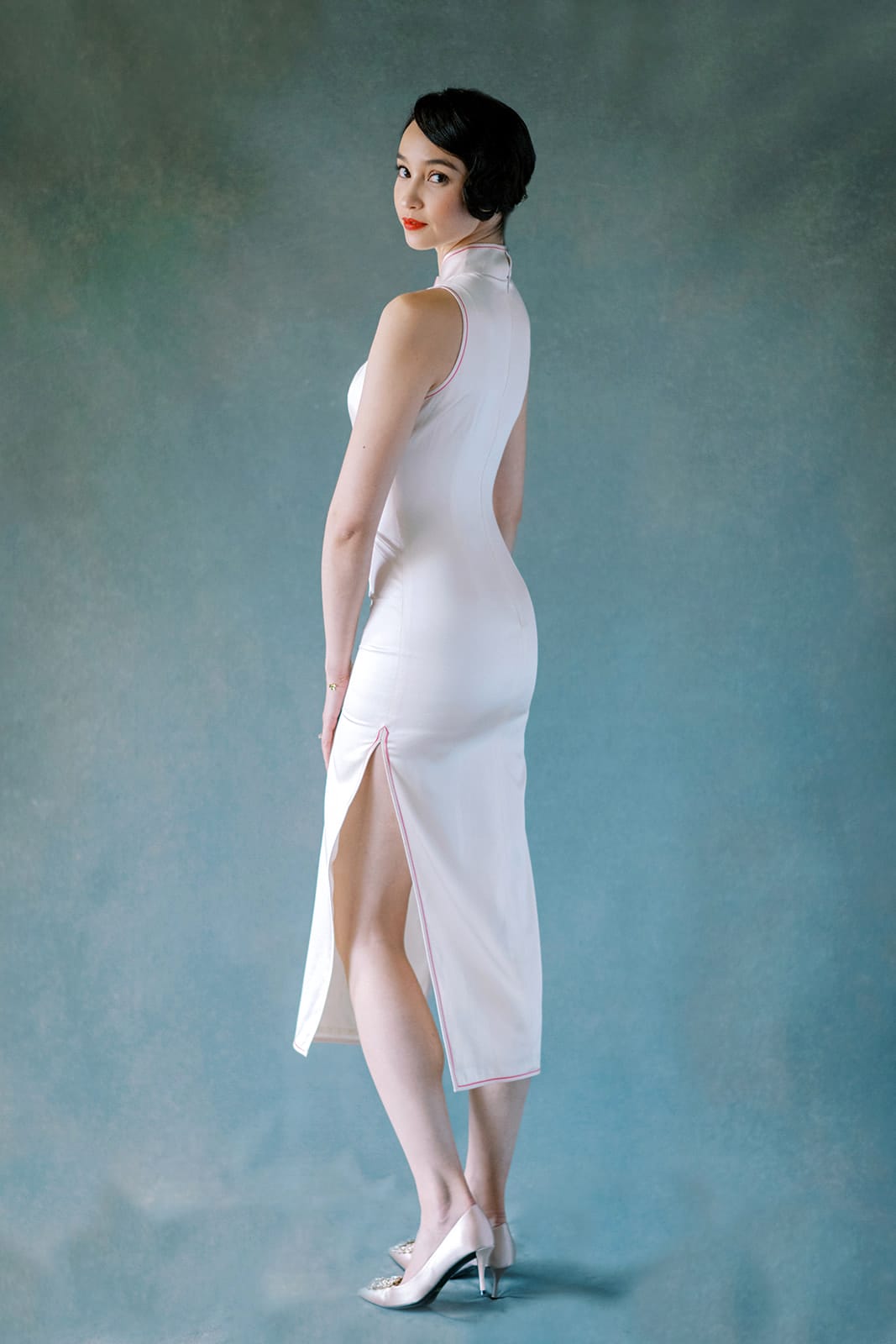Back view of white silk halter Cheongsam dress with pink trim and peony embroidery.