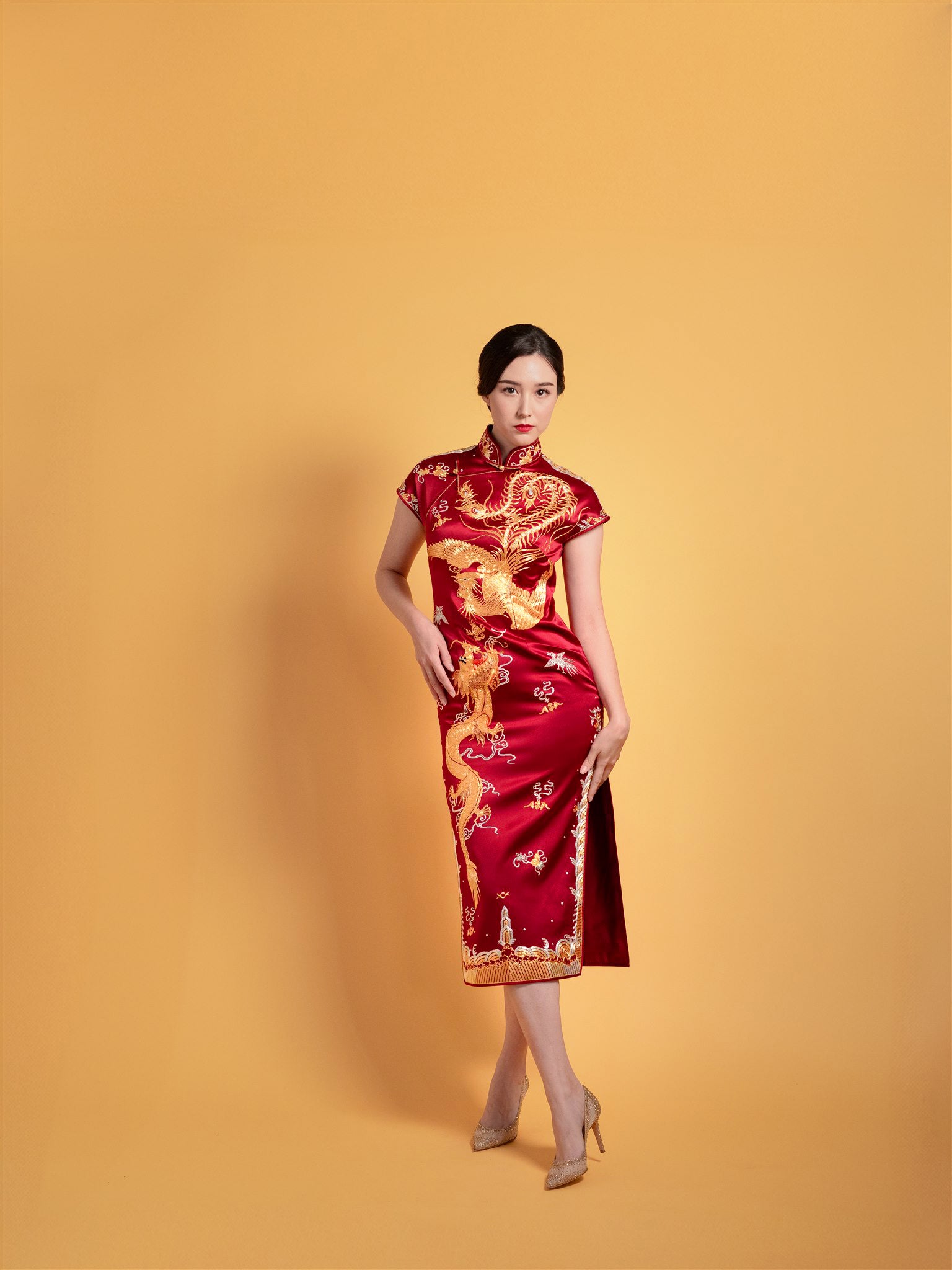 Front view of Wine Red Goldwork I Chinese wedding dress with dragon and phoenix embroidery.