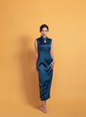 Peacock green sleeveless Qipao dress with an A-line silhouette and waterdrop neckline, perfect for modern elegance.