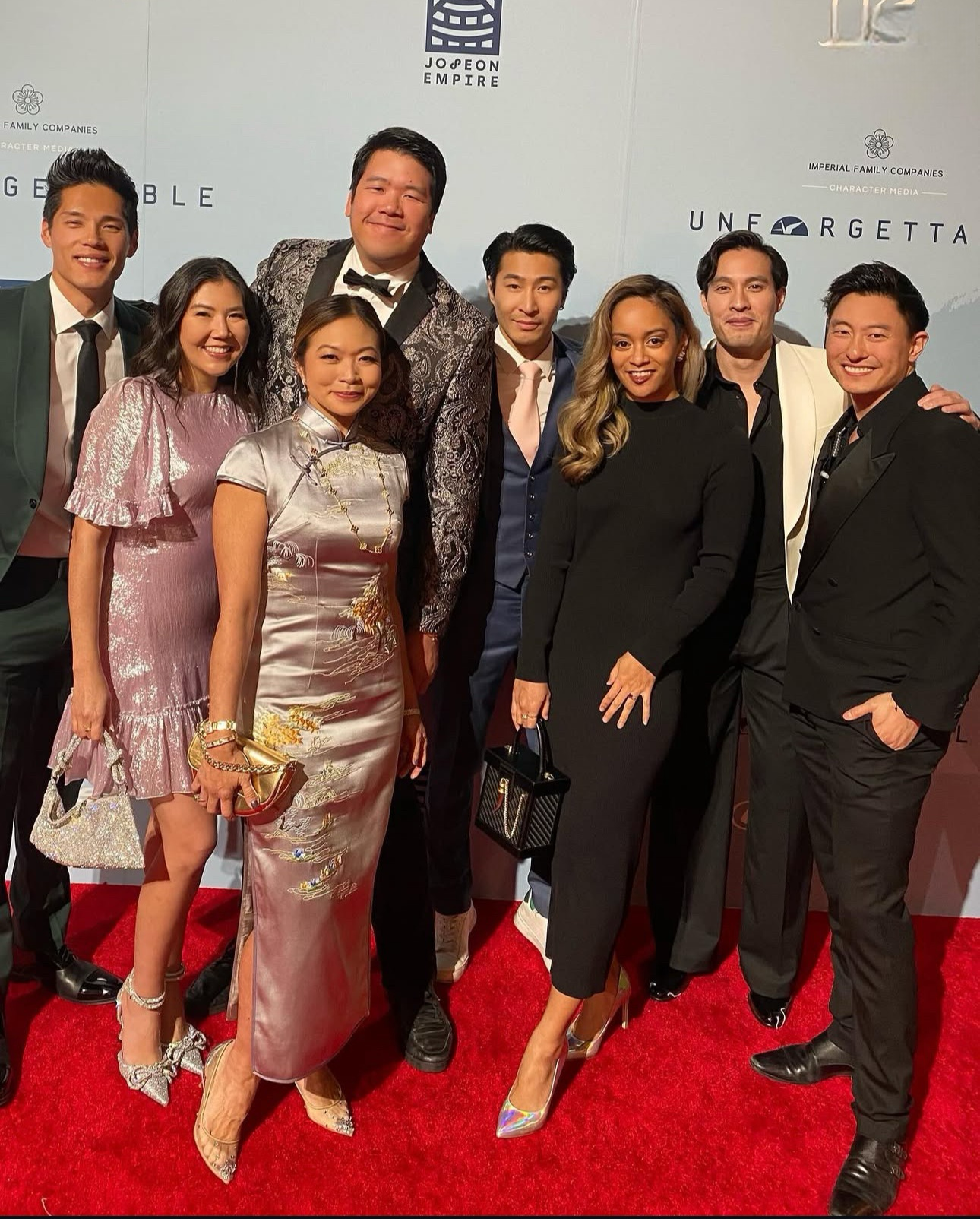 Director Adele Lim wearing a custom silver Qipao with landscape hand embroidery designed by JINZA Oriental Couture at the Unforgettable Gala in Los Angeles