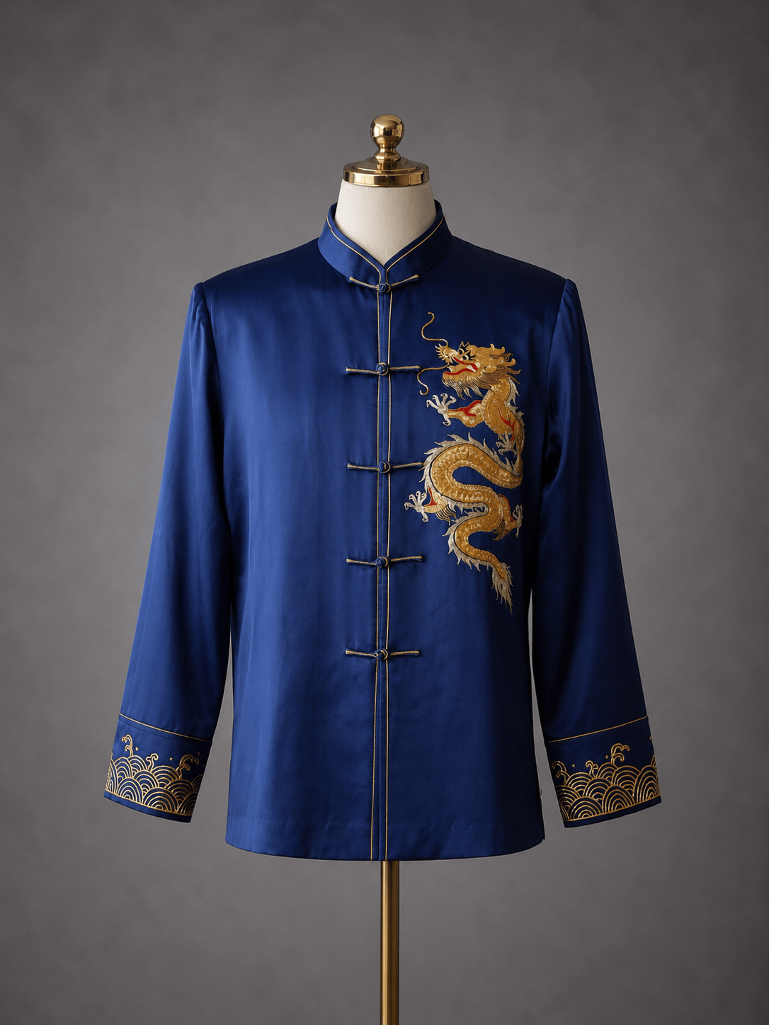 Bespoke navy silk Tang suit with gold dragon hand embroidery and sea wave cuff detail, custom made to measure at JINZA Los Angeles
