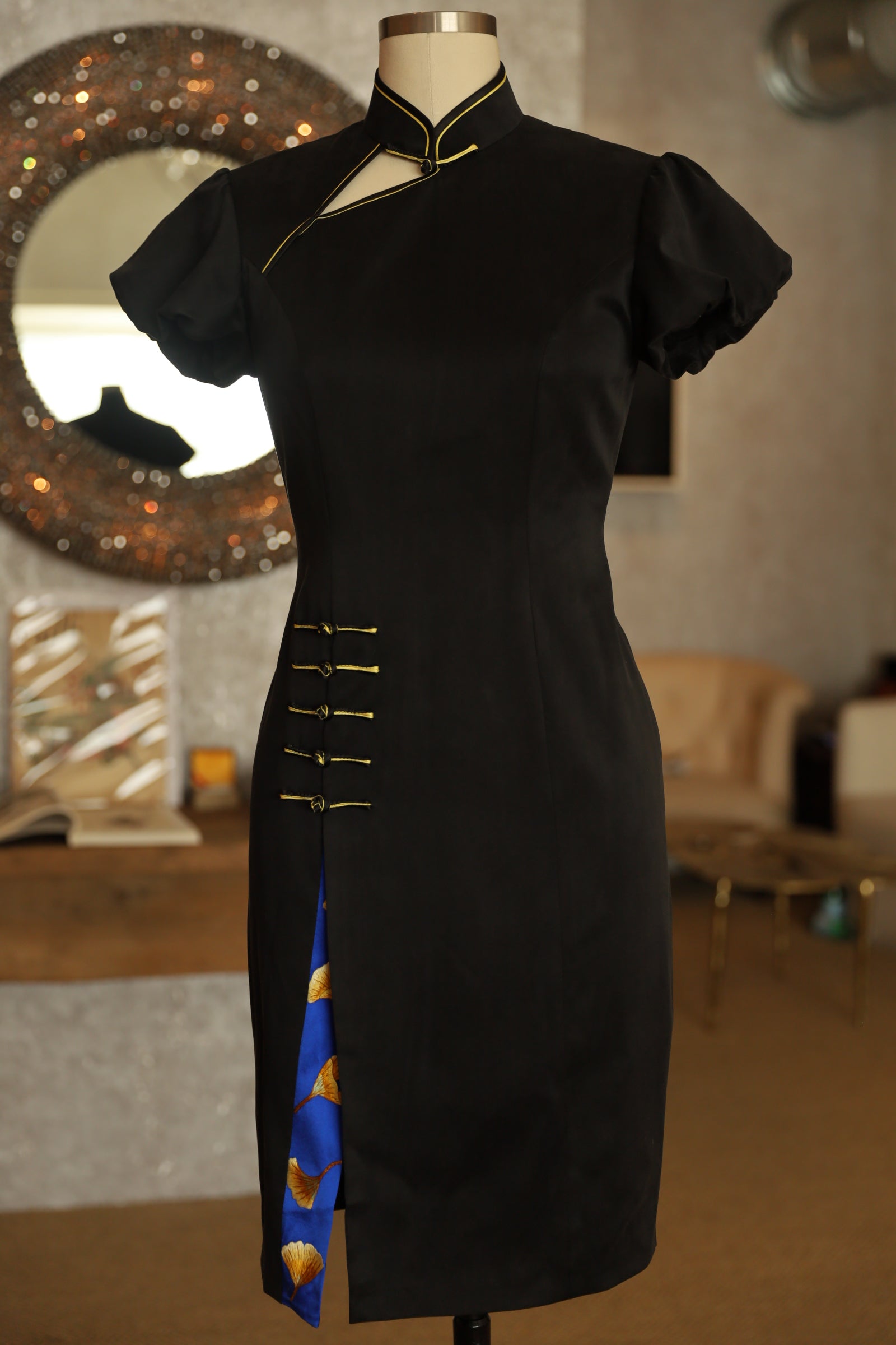 Front view of a black Silk Qipao with Puff Sleeves A Line