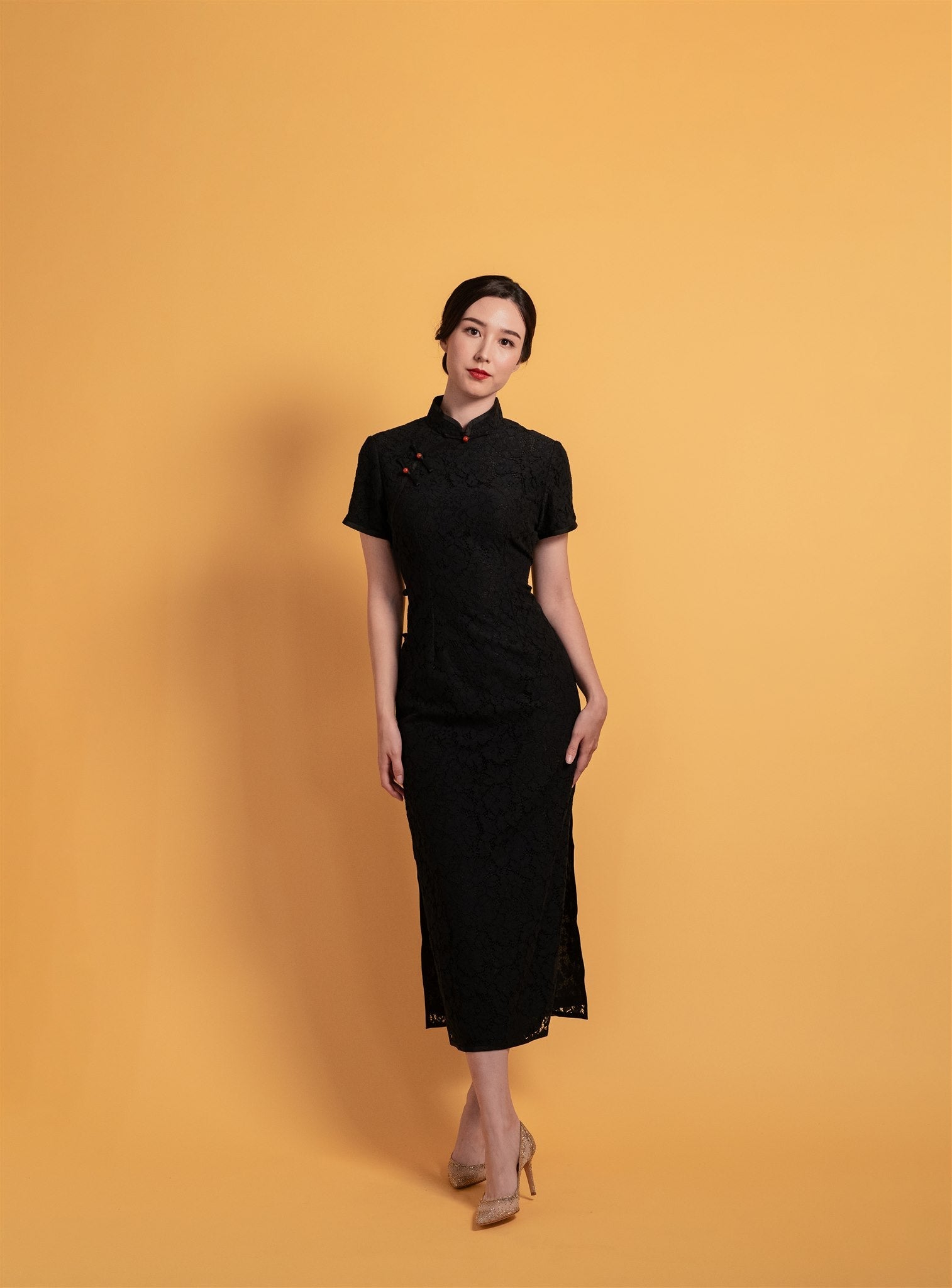 Front view of a black cotton lace Qipao featuring a mandarin collar, frog knot button, and cap sleeves, perfect for daily wear.