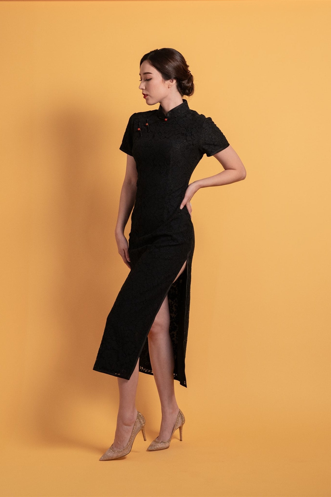 Detail of red Pankou button on black lace Cheongsam with silk lining.