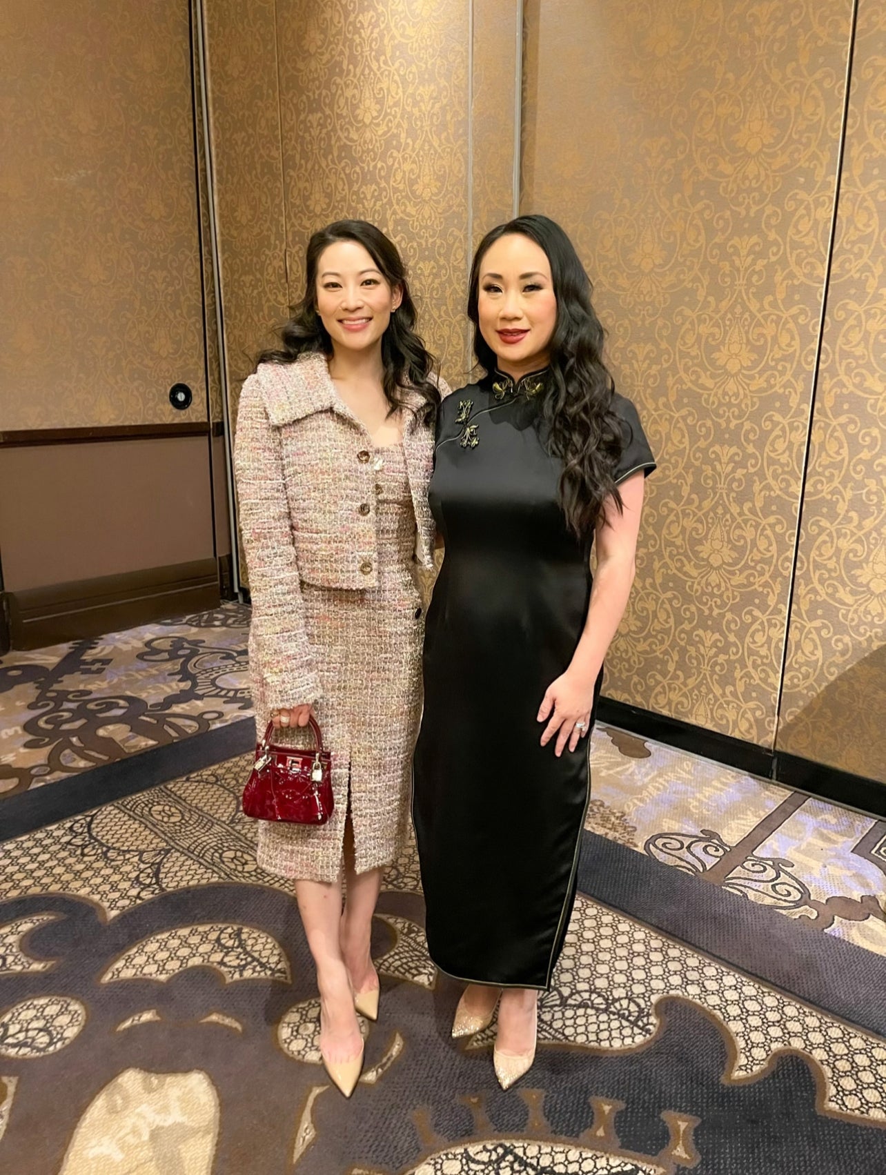 Celine wearing a black silk Qipao dress by JINZA Oriental Couture attending the Association of Corporate Counsel event with actress Arden Cho