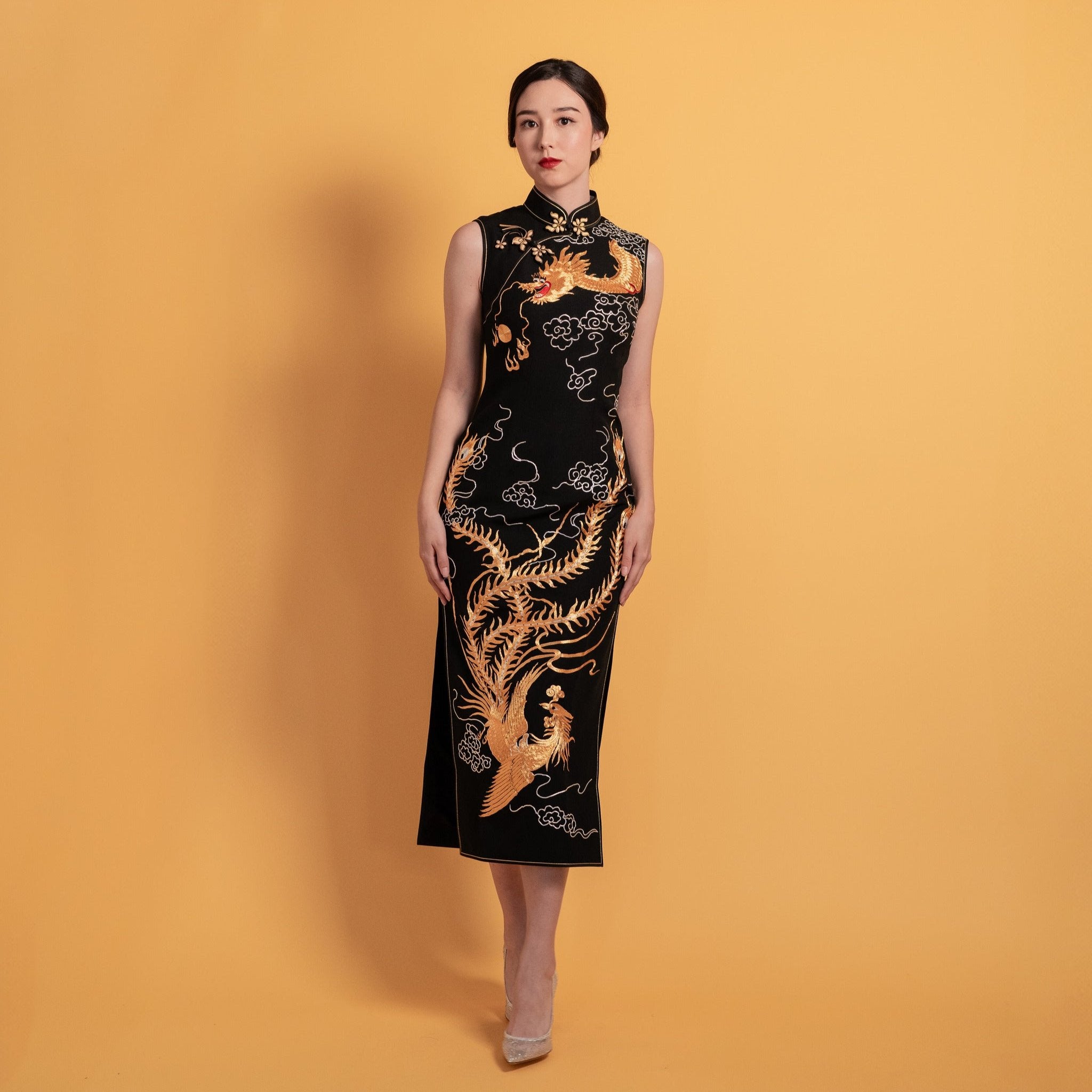 Black silk Qipao Cheongsam with gold dragon and phoenix embroidery, sleeveless. 