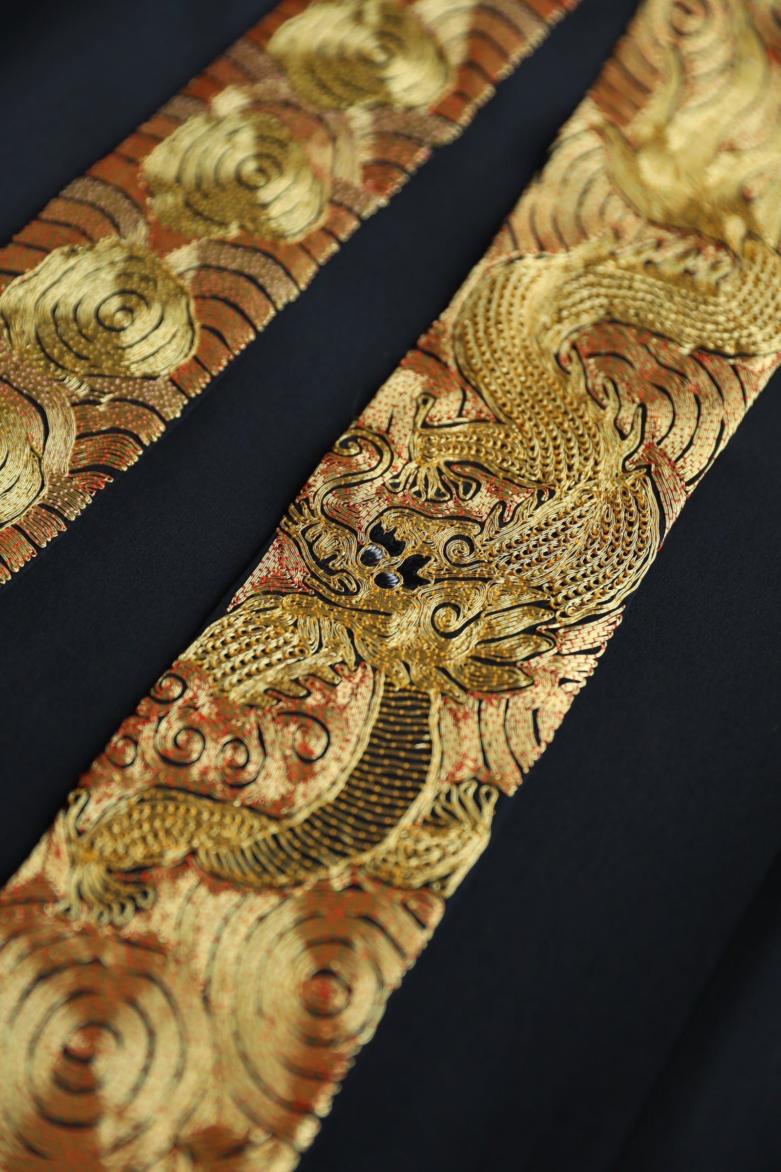 Gold embroidered dragon generation belts on black Tang suit