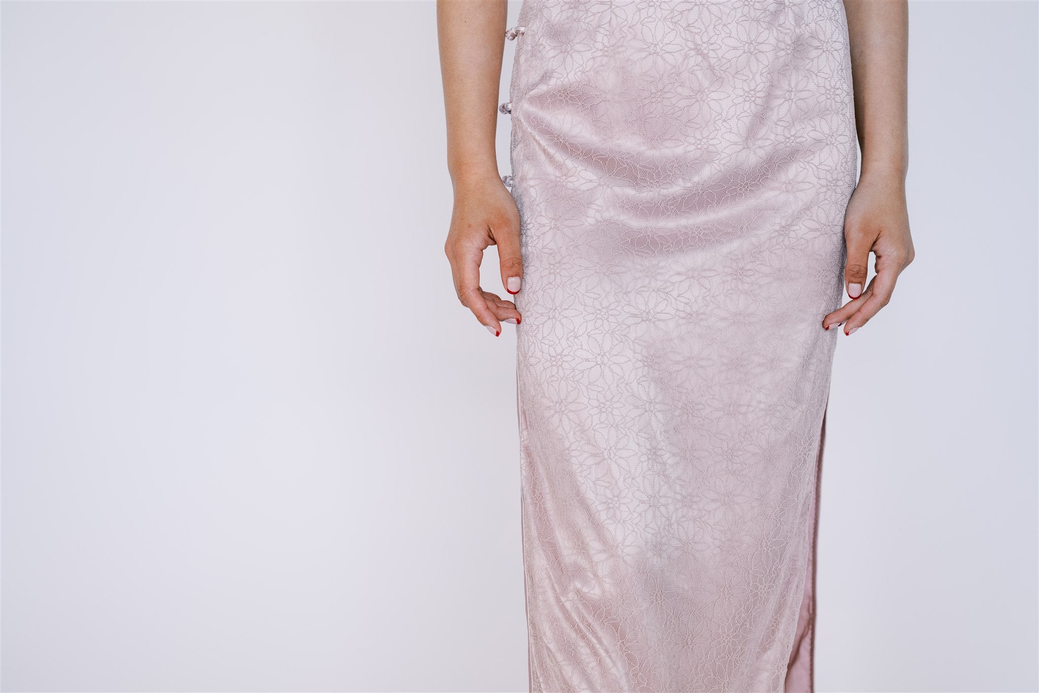 Detail of blush pink lace fabric on Qipao.