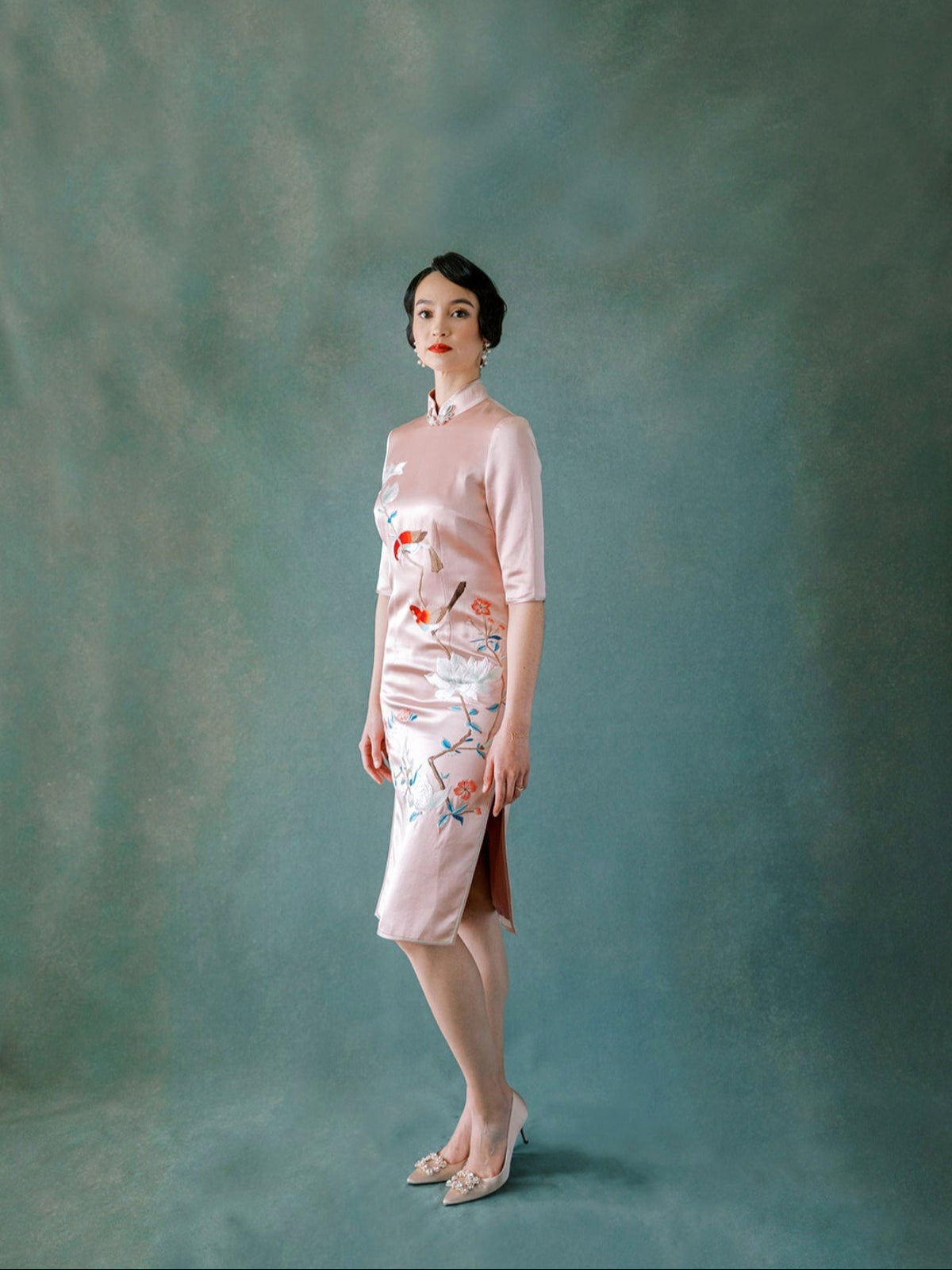 Blush pink silk Qipao with magnolia flower and bird embroidery, inspired by 1920s Shanghai