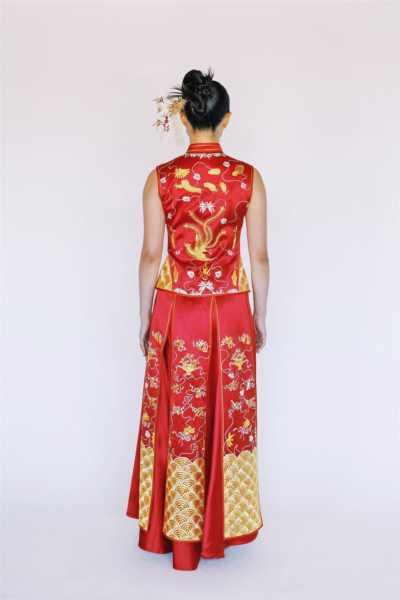 A girl is wearing a modern Xiu He Fu with 8 panels A line skirt, dragon and phoenix embroidery