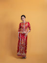 Front view of Chinese wedding dress Qun Kwa Xiao Wu Fu featuring hand-embroidered dragon, phoenix, and peonies, perfect for a tea ceremony.