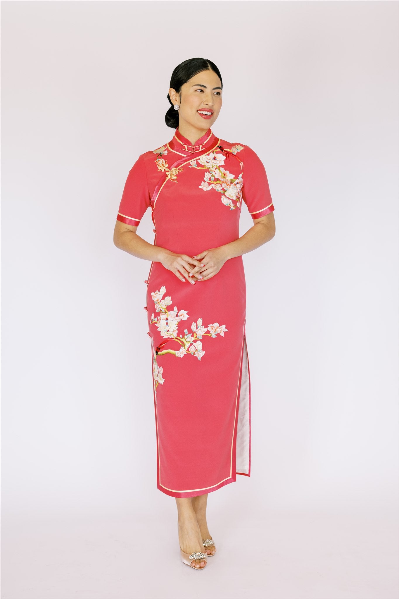 Front view of a hand-embroidered magnolia and birds on Qipao. It is a refined and sophisticated silk cheongsam dress.