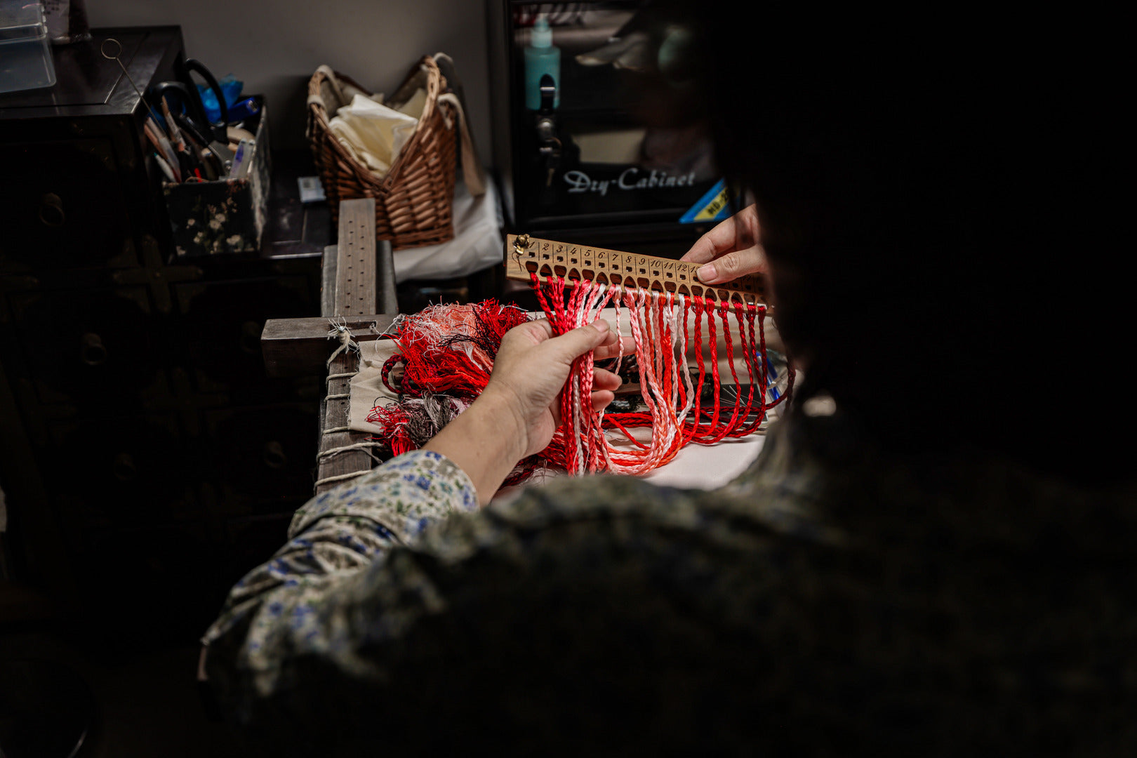 Hand embroidery detail of selecting thread on modern cheongsam