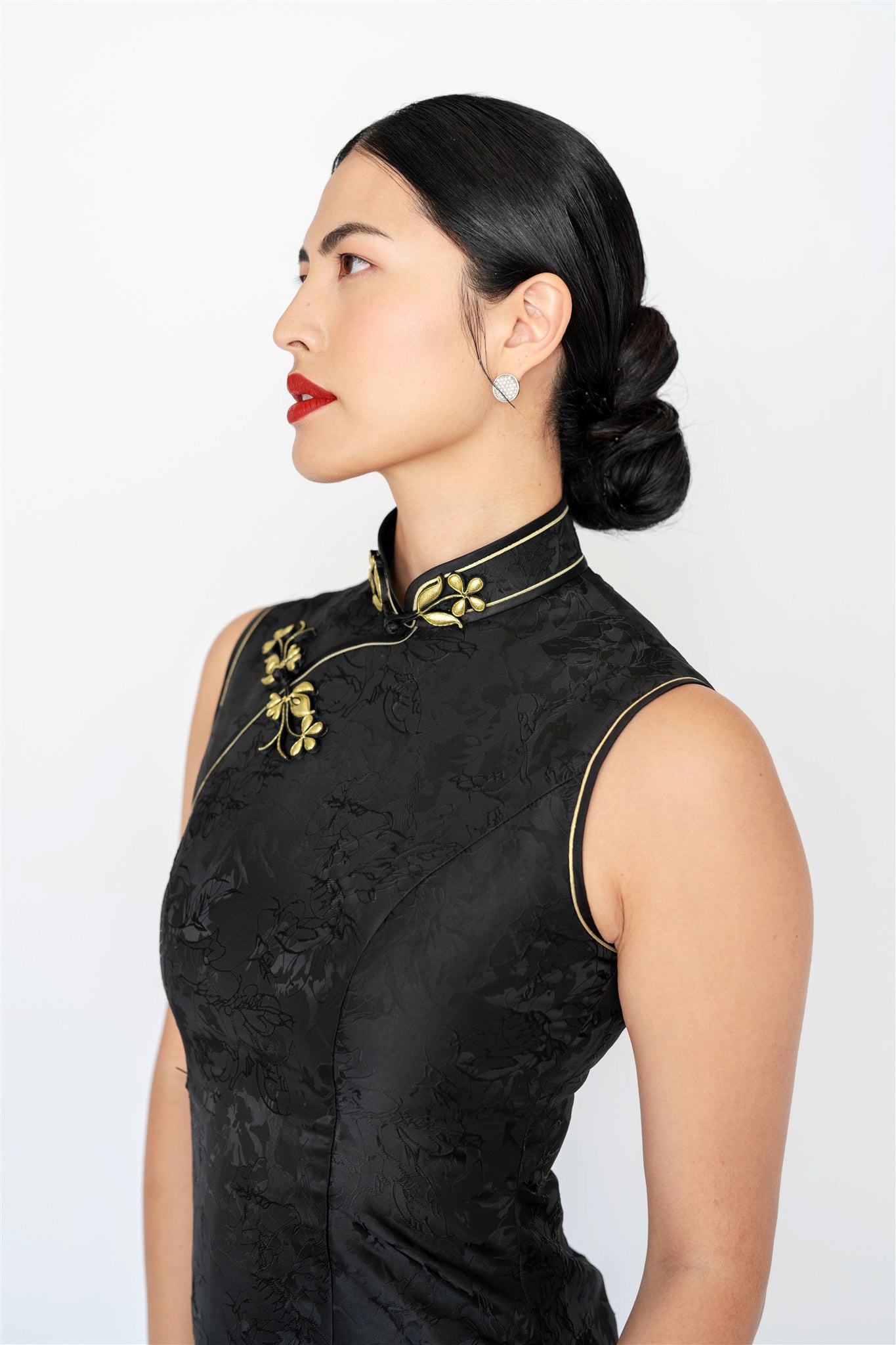 Gold floral pankou closure and silk trim on modern black cheongsam dress
