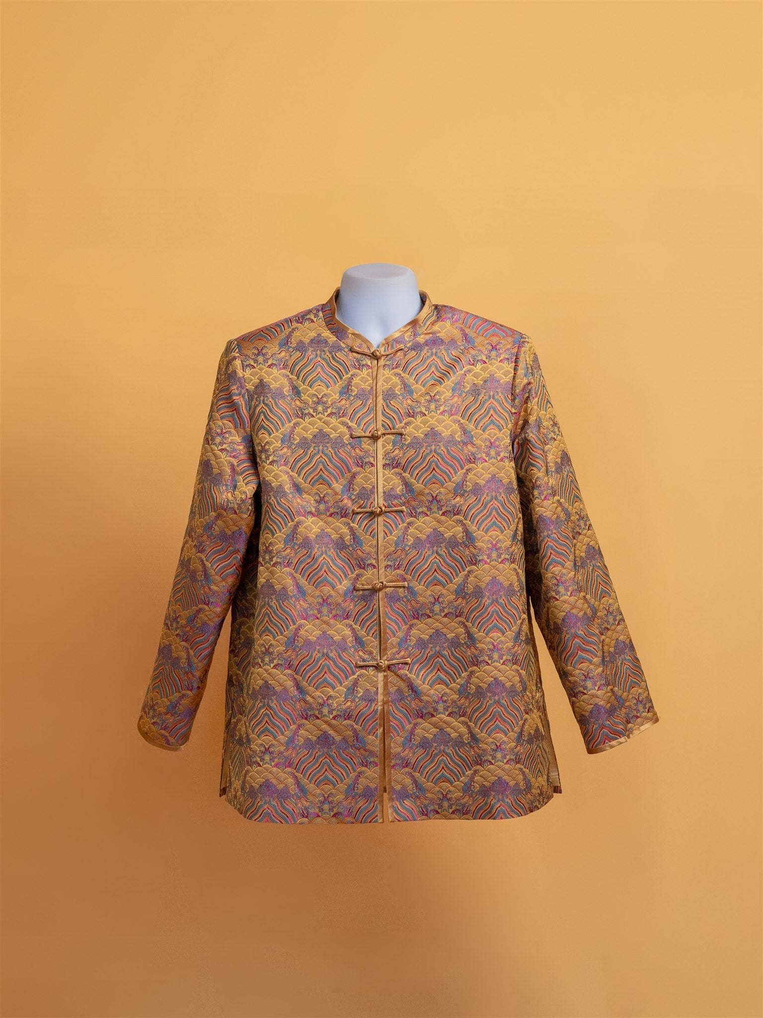 Front view of a gold brocade Tang suit jacket with traditional Chinese design, handcrafted by JINZA.