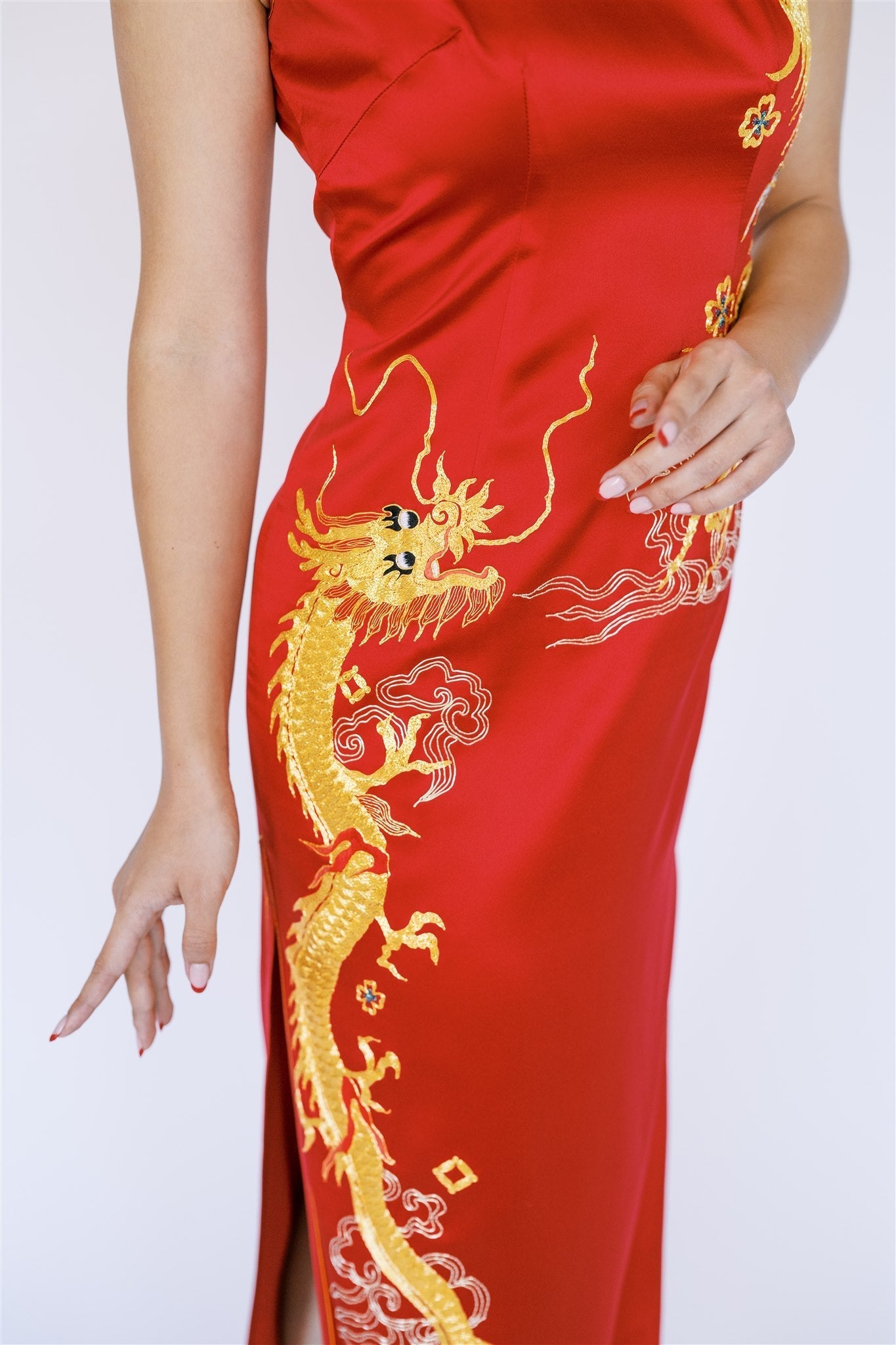 Panjin-embroidered gold dragon on the bodice of a red Chinese dress