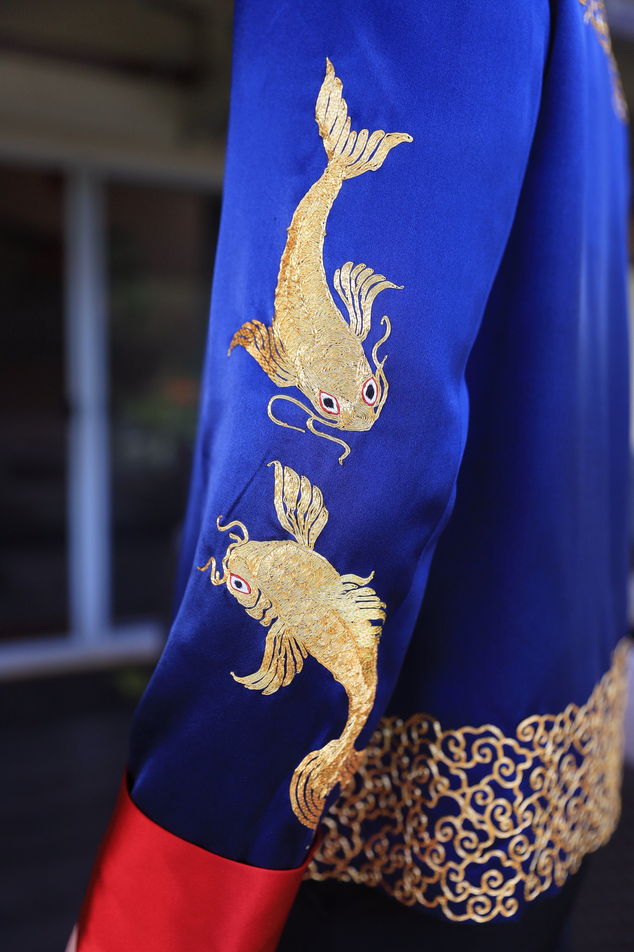 Gold Koi fishes on royal blue silk tang suit for groom