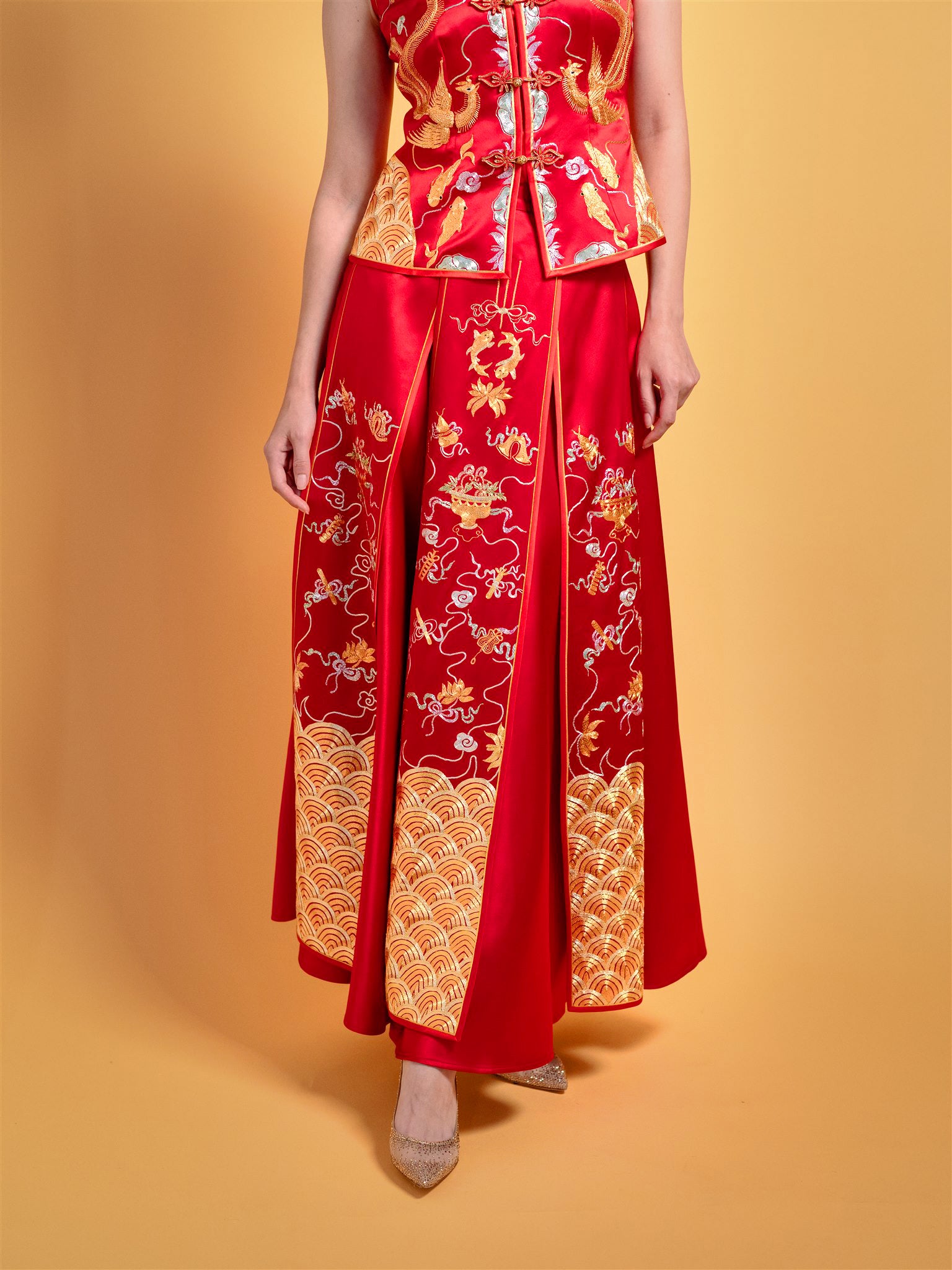 Gold dragon embroidery detail on red silk modern Xiu He Fu wedding dress
