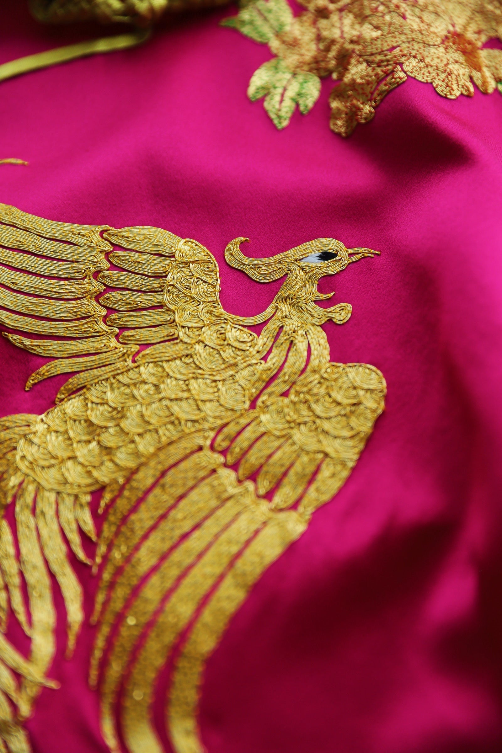 Gold phoenix embroidery on pink Qipao